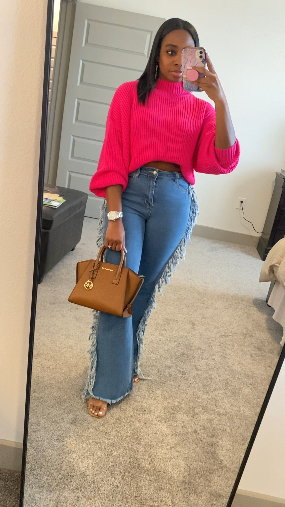 Feeling cute and girly in my pink sweater and fringe flare jeans  This outfit was a hit for girls night out. #girlsnightoutfit #girlsnight #springoutfit #amazonfinds
