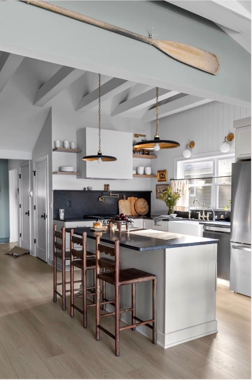 The cozy cottage kitchen is all about timeless layers-warm wood stools, crisp walls and cabinetry and those black and brass pendants that instantly ground the space. The lighting is what makes it feel collected and custom without overthinking it. If you want this balanced, modern cottage look, I've linked the fixtures and details so you can recreate it in your own home.  
#transitionaldesign
#moderncottage
#kitchenlighting
#collectedhome

#LTKSaleAlert #LTKHome #LTKSeasonal