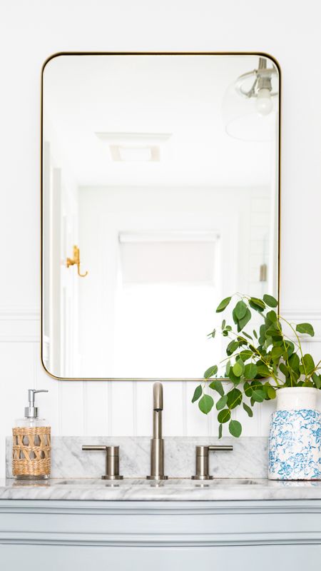 Coastal style bathroom with brass fixtures and white tile. Bathroom accessories, and home decor.

#LTKhome #LTKfamily