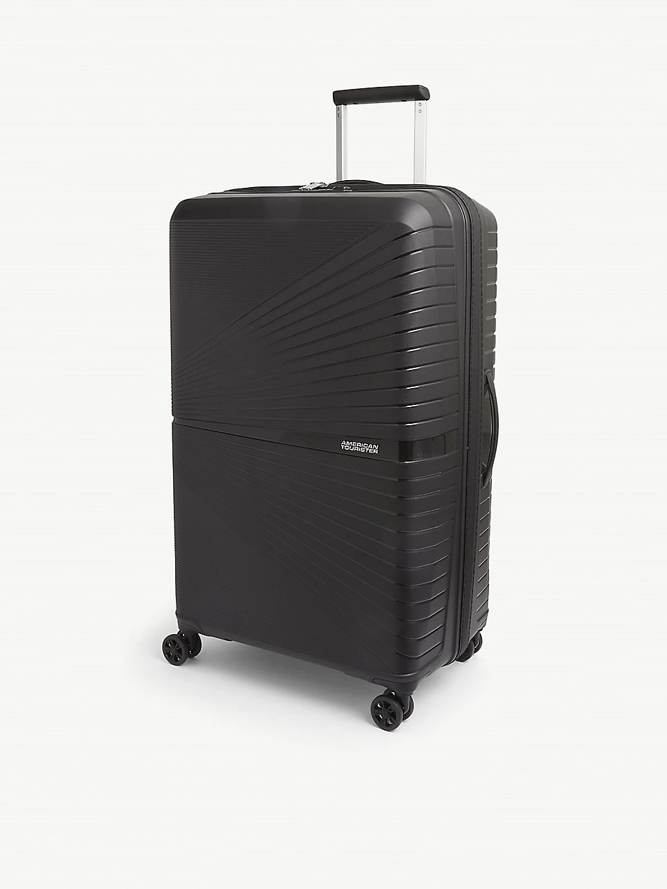 Airconic four-wheel shell suitcase 77cm | Selfridges