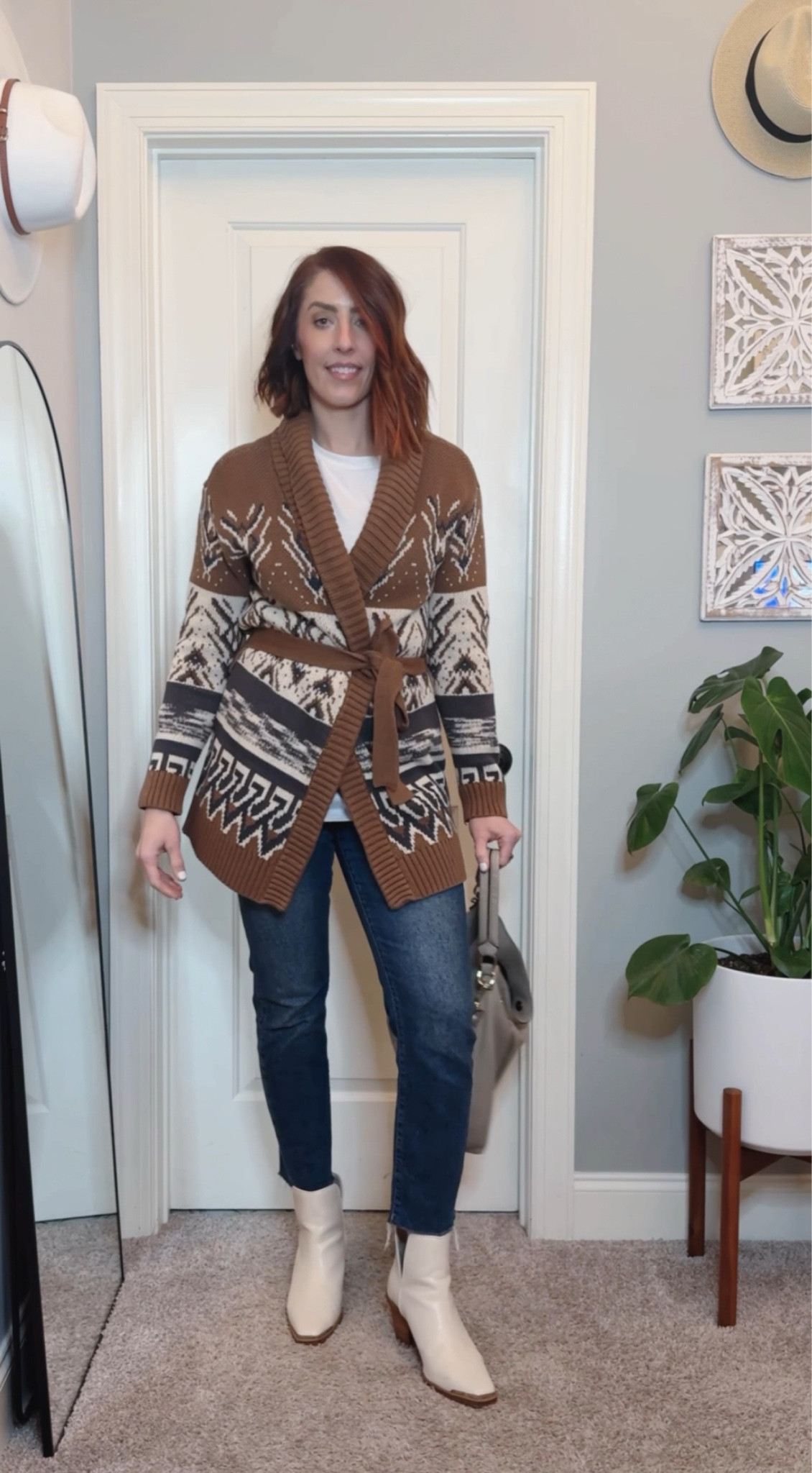 I paired an oversized white long sleeve tunic shirt with a cozy, western-inspired belted cardigan duster, cropped straight-leg jeans, modern white western booties, and my go-to beige hobo bag. 

#LTKStyleTip #LTKShoeCrush #LTKFindsUnder100
