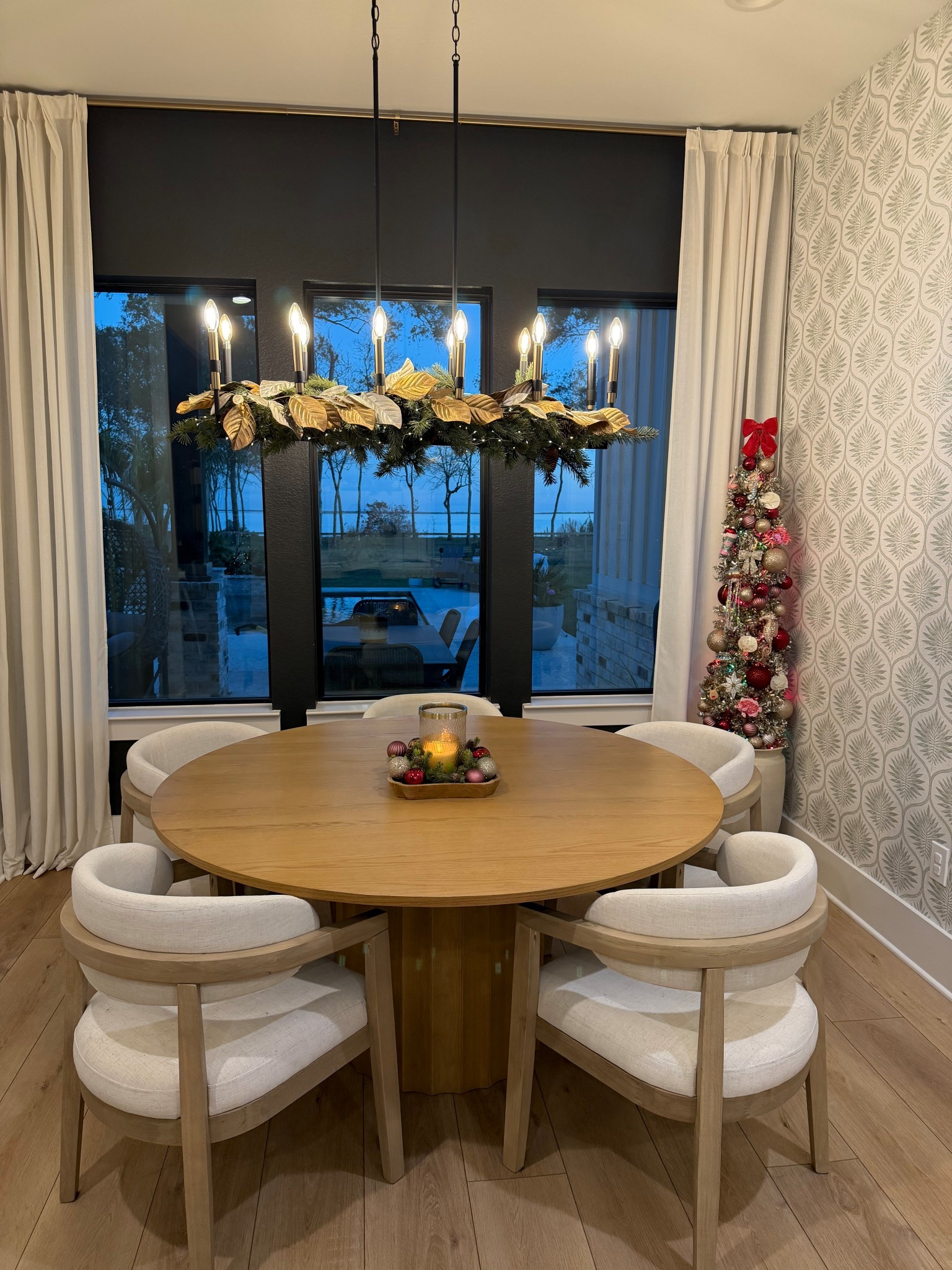 Cozy Christmas dining nook. Still loving our dining table and chairs from The Home Depot! I need to wallpaper the opposing wall to match this one. 

#LTKHome #LTKHoliday