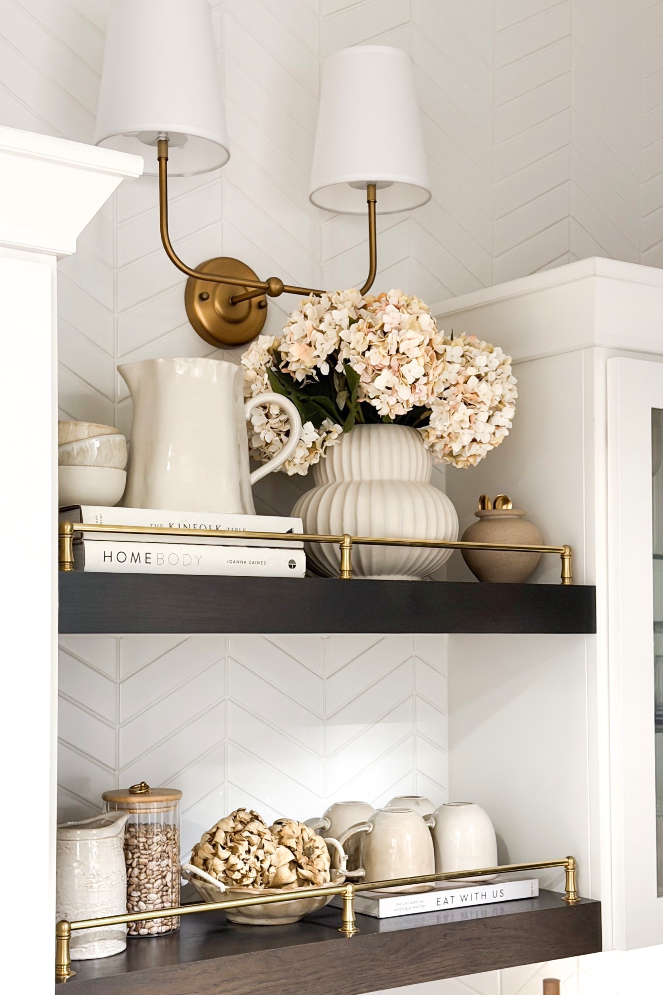 Gave this space in our kitchen a little makeover!

Home, home decor, home accents, home finds, kitchen, kitchen inspo, kitchen shelves, coffee book, gallery rail, cookbooks, faux florals, canister, coffee mugs, wall sconce, modern lighting, modern home, neutral home, organic home 

#LTKHome #LTKSeasonal