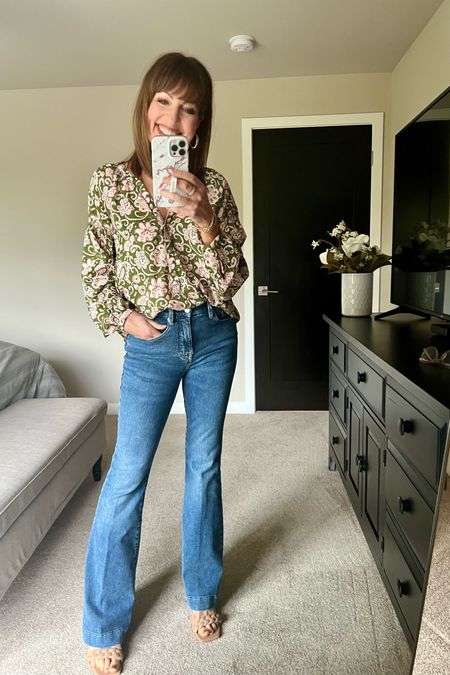 Outfit of the night!! I love my new Sanctuary blouse! My Good American Good Legs Flare jeans are also so flattering. I love the mid rise and the flare leg. I’m also wearing the most comfortable Dolce Vita neutral sandals! 

Date night outfit, printed long sleeve blouse, spring outfit, denim outfit. 

#LTKstyletip #LTKover40 #LTKfindsunder100