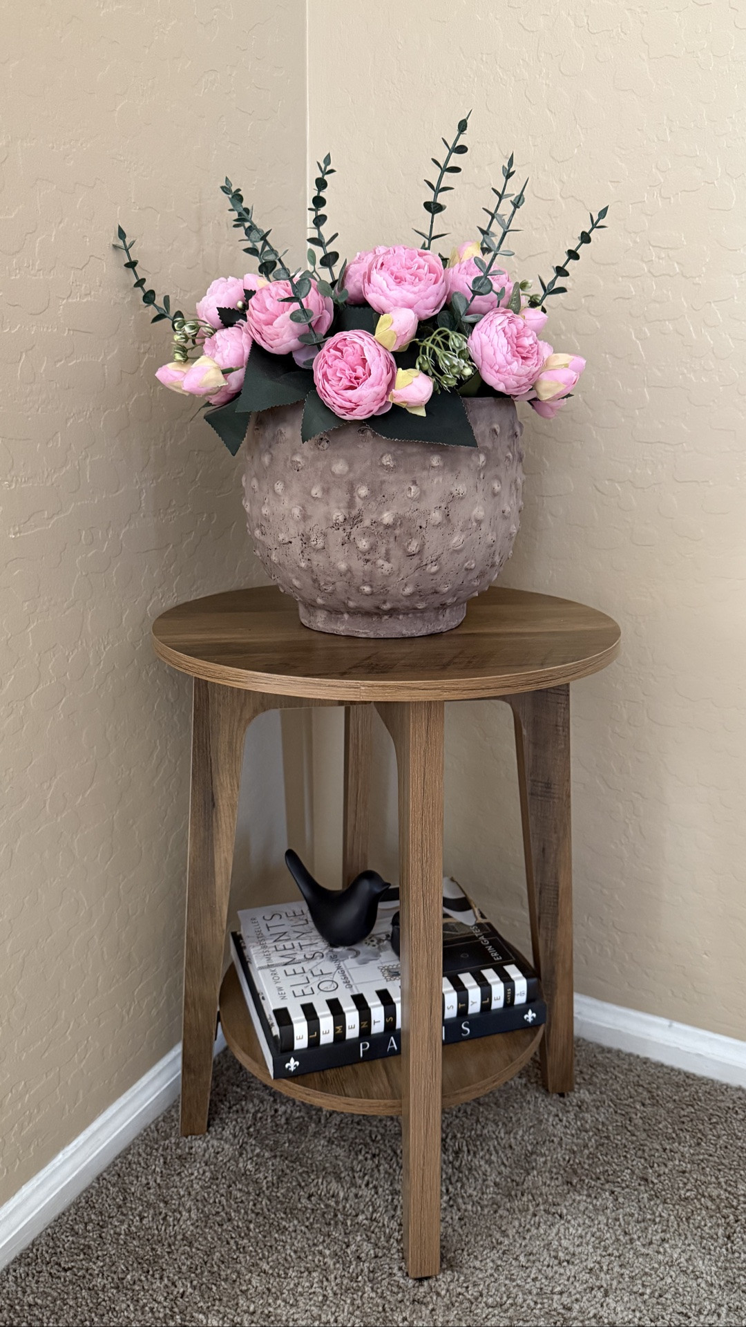 This cute two-tier side table from Amazon and wall art from Target create a charming corner styling in a small space. The table is sturdy enough to hold several books or decorative items.

#LTKSeasonal #LTKHome #LTKSaleAlert