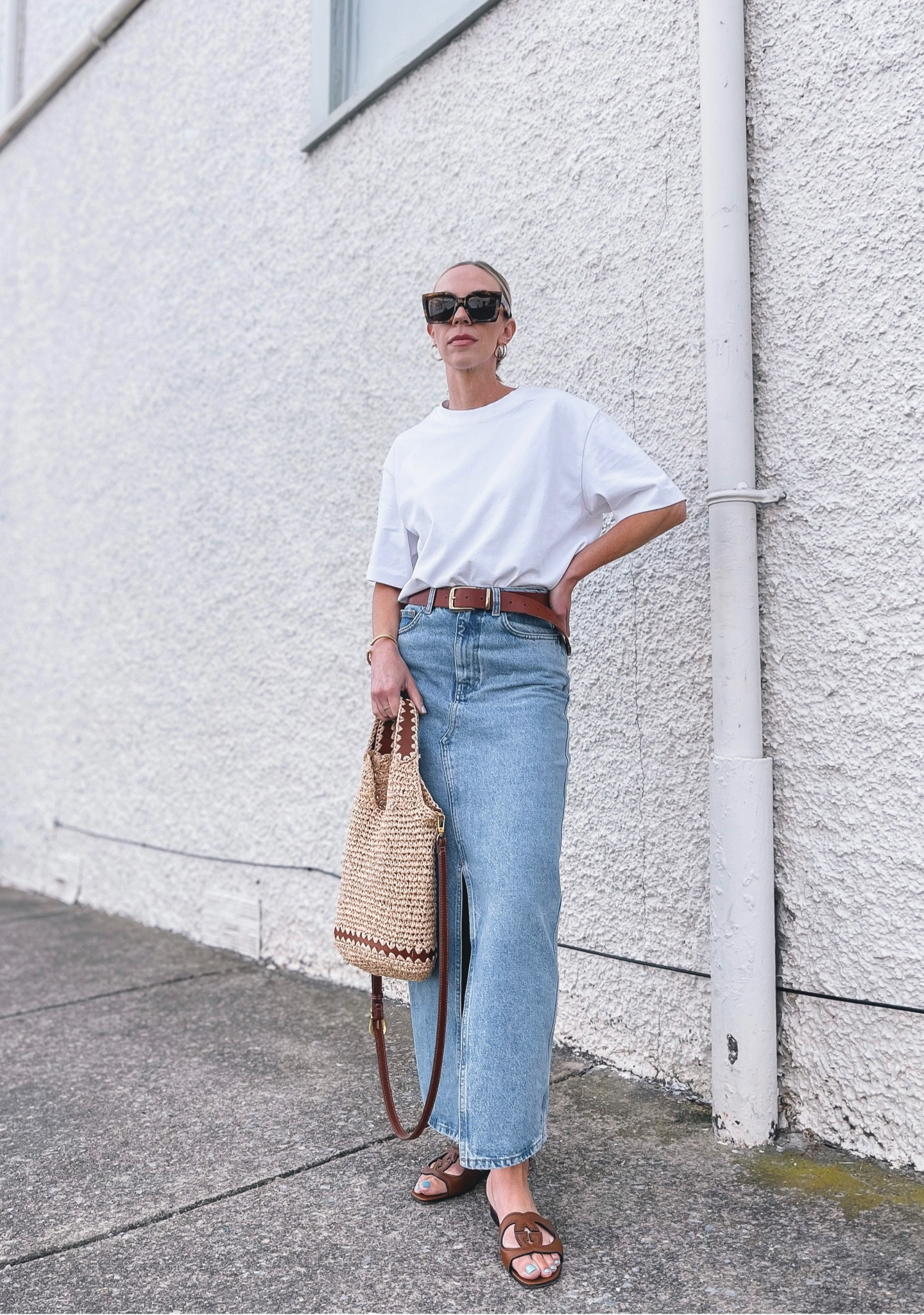 White tee with denim skirt, denim maxi skirt, Madewell leather belt, straw tote bag, affordable summer fashion 

#LTKunder100 #LTKsalealert #LTKitbag