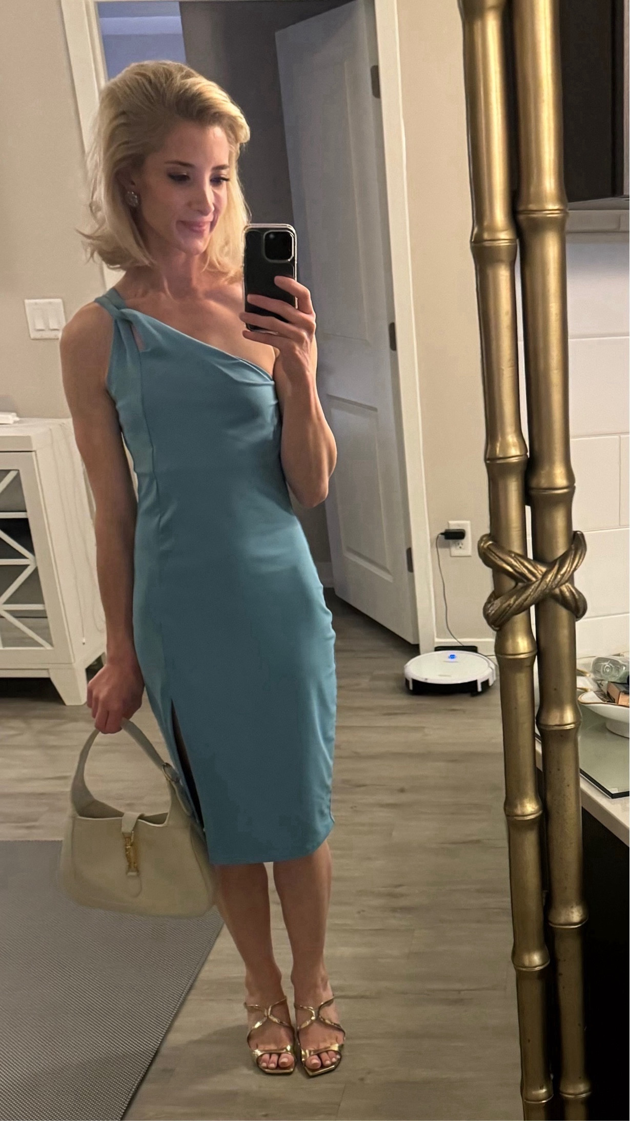 I recently chose a chic teal-colored dress for a Palm Beach holiday party outfit. In Palm Beach, teal is the perfect color to choose if you’re looking for a holiday outfit with an updated spin on the traditional colors you see in December: dark hunter green and Christmas red. Its timeless design ensures it won't be a one-time wonder, aligning perfectly with my philosophy of investing in enduring pieces. 🩵

I paired the holiday dress with my gold open-toe wedges by Jimmy Choo, adding a touch of glamour and sophistication to the overall look. The subtle yet eye-catching details of the dress and the luxury footwear create a harmonious, festive, and effortlessly chic look. 💛

To complete the ensemble, I had the pleasure of borrowing a gorgeous Gucci purse from my mom for the month. This purse, a testament to timeless style and quality craftsmanship, complemented the outfit flawlessly. It's a prime example of an accessory that can elevate any look and make a statement without relying on fleeting trends. 🤍

Shopping for a holiday gift for her? Click the “Jackie 1961 Small Shoulder Bag” product below by Gucci. The bag I’m wearing in this photo is in white leather. It is available in the same size in black. I love the medium size version of this same bag, too. It’s available to shop in this post in two colors: 1. Cuir Brown Leather and 2. Black Leather. 🤎🖤

Seeking the perfect holiday outfit and gift ideas for her? Comment below for more ideas! I’m so happy to help! ✍️🫶

#LTKHoliday #LTKstyletip #LTKGiftGuide