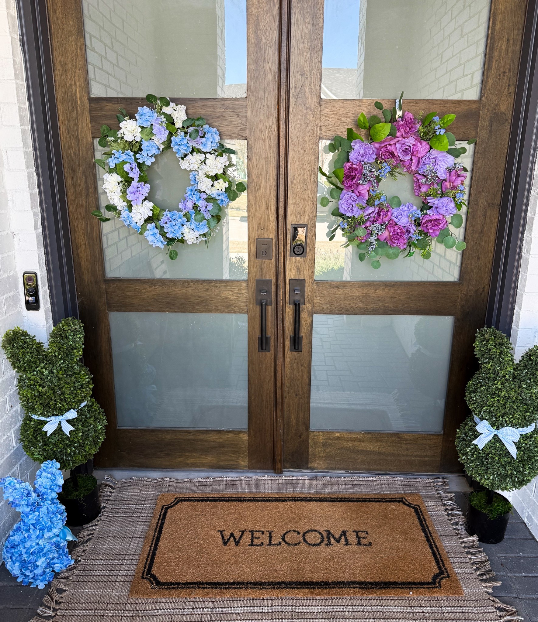 Spring front porch 
Deciding between two wreaths 

#LTKspring #LTKHome #LTKunboxing