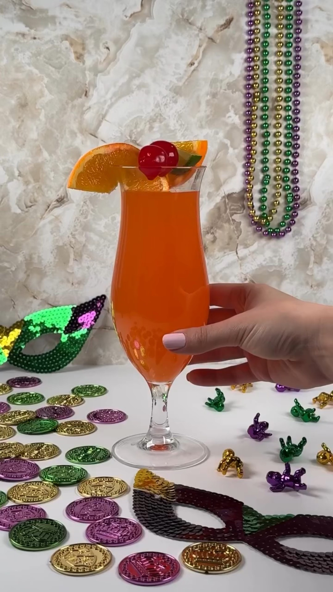 Laissez les bons temps rouler!🍹🎭⚜️

You can’t celebrate Mardi Gras without a drink from Pat O’Brien’s in the French Quarter. If you’re not in NOLA, you can recreate this drink at home! 💜💛💚

Hurricane ingredients:
2 oz Light rum
2 oz Dark rum
2 oz Passion fruit juice
1 oz Fresh orange juice
1 oz Fresh lime juice 
1 tbsp Simple syrup
1 tbsp grenadine 
Garnish: Slices of orange, lemon, and lime + maraschino cherries

Instructions:
1. Add all ingredients into a cocktail shaker and add ice. 
2. Shake well until thoroughly chilled.
3. Strain into a hurricane glass. (Add ice into hurricane glass first if you prefer.)
4. Garnish with citrus slices + cherries.
5. Enjoy! 🎭
 
@masterofmixes_ @modern.mixology @welchs #mardigras #mardigras2026 #frenchquarter #neworleans #nola

#LTKvlog #LTKfoodie #LTKSeasonal