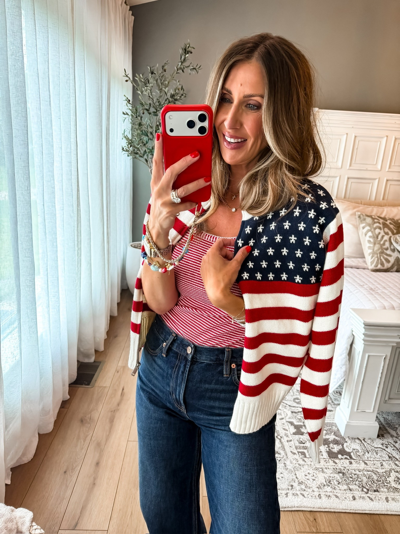 This striped tank and denim combo is such an easy way to do patriotic style without feeling over the top. Add the flag sweater for cool nights, fireworks, lake weekends, and all your Fourth of July plans.

Fourth of July outfit, patriotic style, red white and blue outfit, summer denim, striped tank, Americana fashion, holiday outfit, casual summer style, lake weekend outfit, July 4th look, summer fashion, TheMomInStyle

#LTKootd #LTKSeasonal #LTKTravel