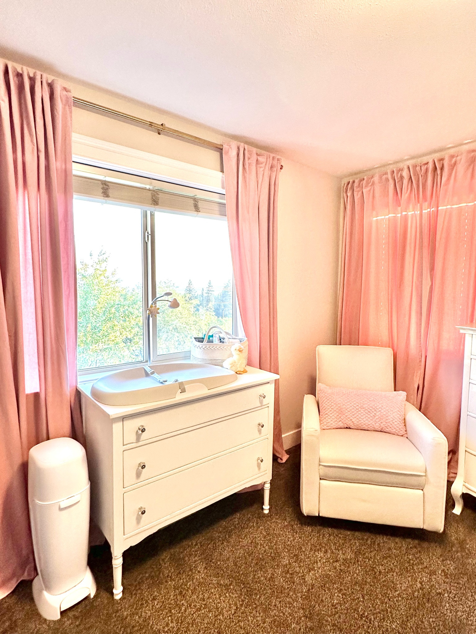 I love our little girls’s nursery, it’s so feminine! Using a dresser instead of a change table, allowed us hidden storage plus it will grow with her! The velvet curtains really make this room chic! 