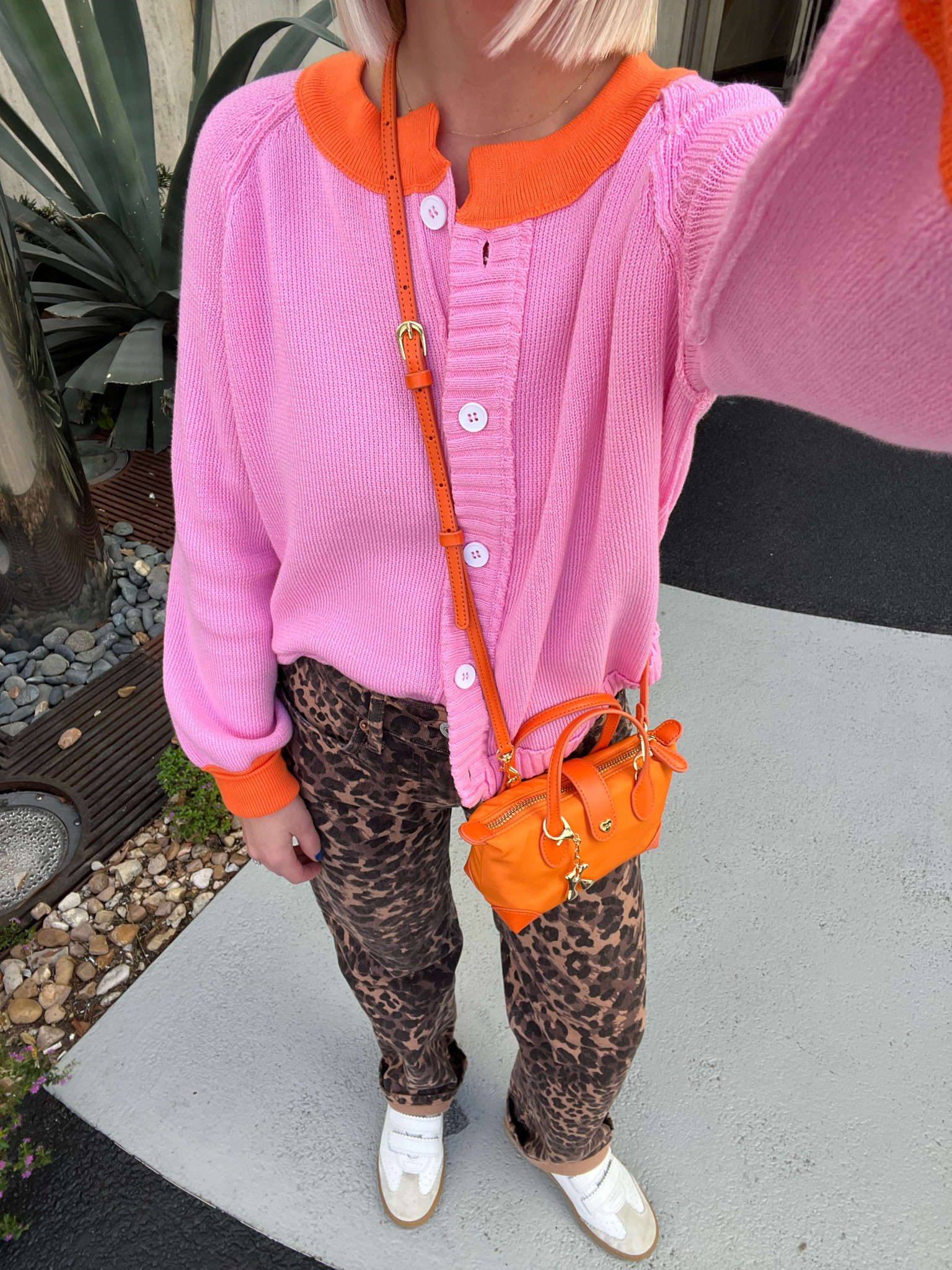 Pink and orange color block cardigan (size: medium, sized up for looser fit) / leopard print jeans (size: 24 short, run a size big) / Velcro sneakers (size: 38, I’m a true 7 and sized up one) / pouchette crossbody bag (color: MARIGOLD, NOT peach) / orange crossbody bag / New Orleans style / New Orleans outfit 

#LTKSaleAlert #LTKHoliday #LTKTravel
