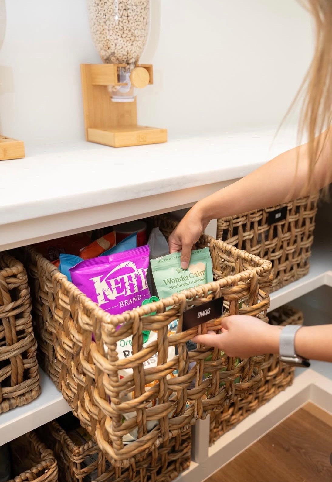 We love using bin organizers inside a larger decorative bin to create a snack zone that feels both functional and elevated.

Is your pantry summer ready?  Admit it, it’s true. The first place your kids are heading when summer arrives is the SNACK ZONE! If your little people are in your pantry day in and day out, asking for food, moving things around, and eating their way through your supplies, a designated snack station may be just what you need to reinstate order and rein in the chaos.

#LTKmomlife #LTKHome #LTKKids
