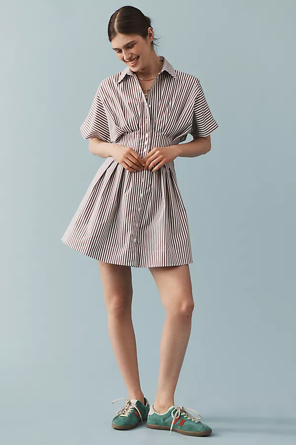 The @heynasreen Tobie Button-Front Pleated Mini Shirt Dress by Exquise | Anthropologie (US)