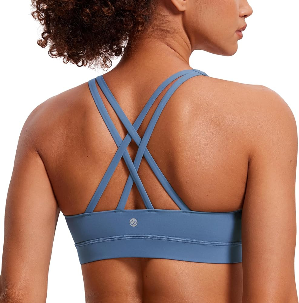 CRZ YOGA Women's Strappy Sports Bras Fitness Workout Padded Yoga Top Criss Cross Back Cami | Amazon (US)