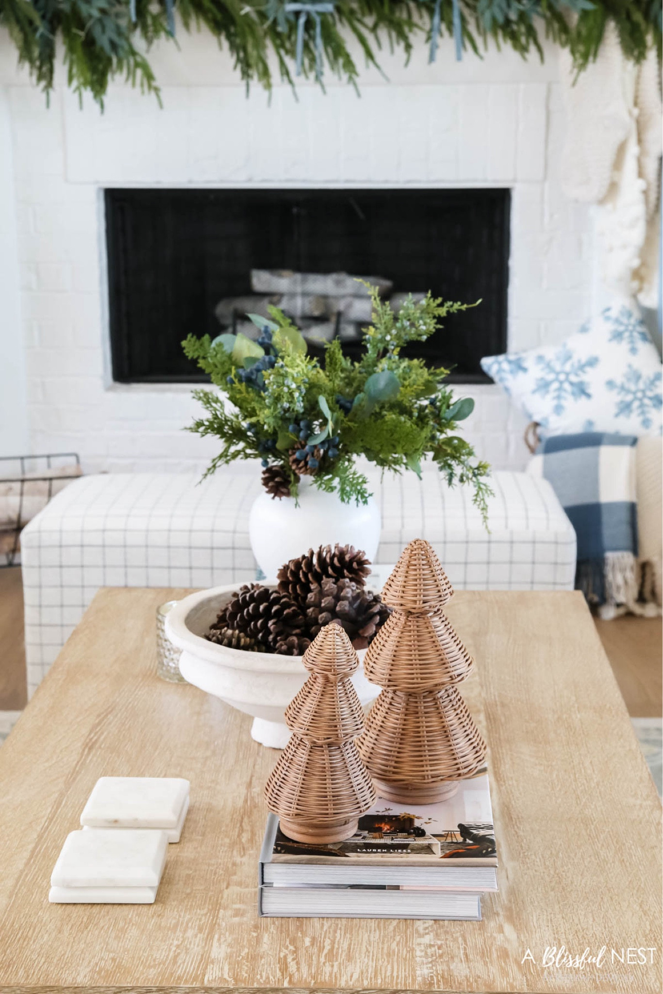 Christmas coffee table style. Includes the viral rattan trees, a bowl of pinecones, berry pine stems. 

Holiday home tour, Christmas, home tour, Christmas decor, coastal style, coastal grandmother

#LTKHoliday #LTKSeasonal #LTKHome