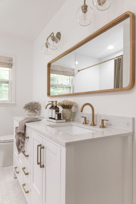 White bathroom vanity, brushed gold bathroom scones, bathroom organisation, custom Roman blinds, brushed gold faucets, bathroom renovation, bathroom style 

#LTKunder50 #LTKhome #LTKSeasonal