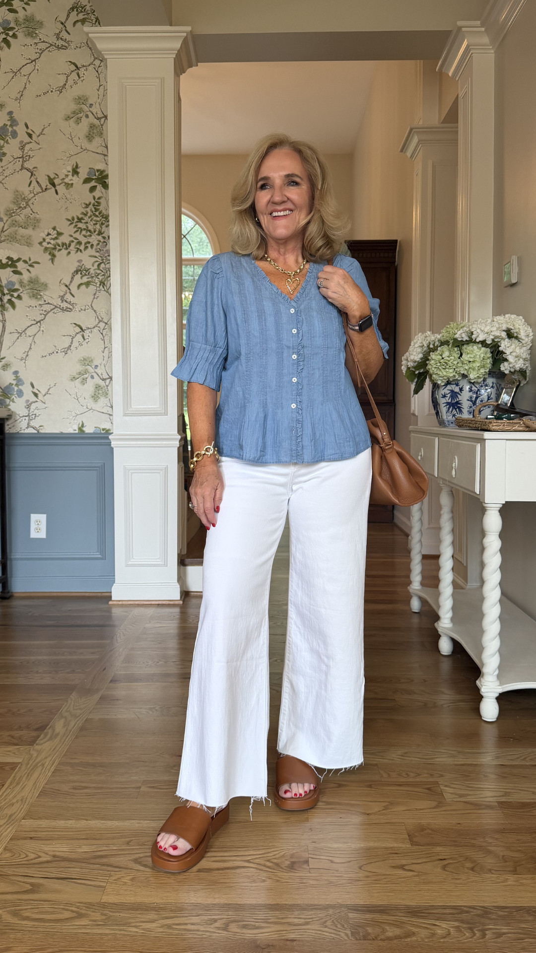 A soft chambray blouse, crisp white denim, and warm cognac accessories create that effortless balance between polished and relaxed. It's light, easy to wear, and works whether you're headed to brunch, running errands, or meeting friends for lunch. 🫶🏻 

 #LTKootd #LTKSeasonal #LTKSaleAlert