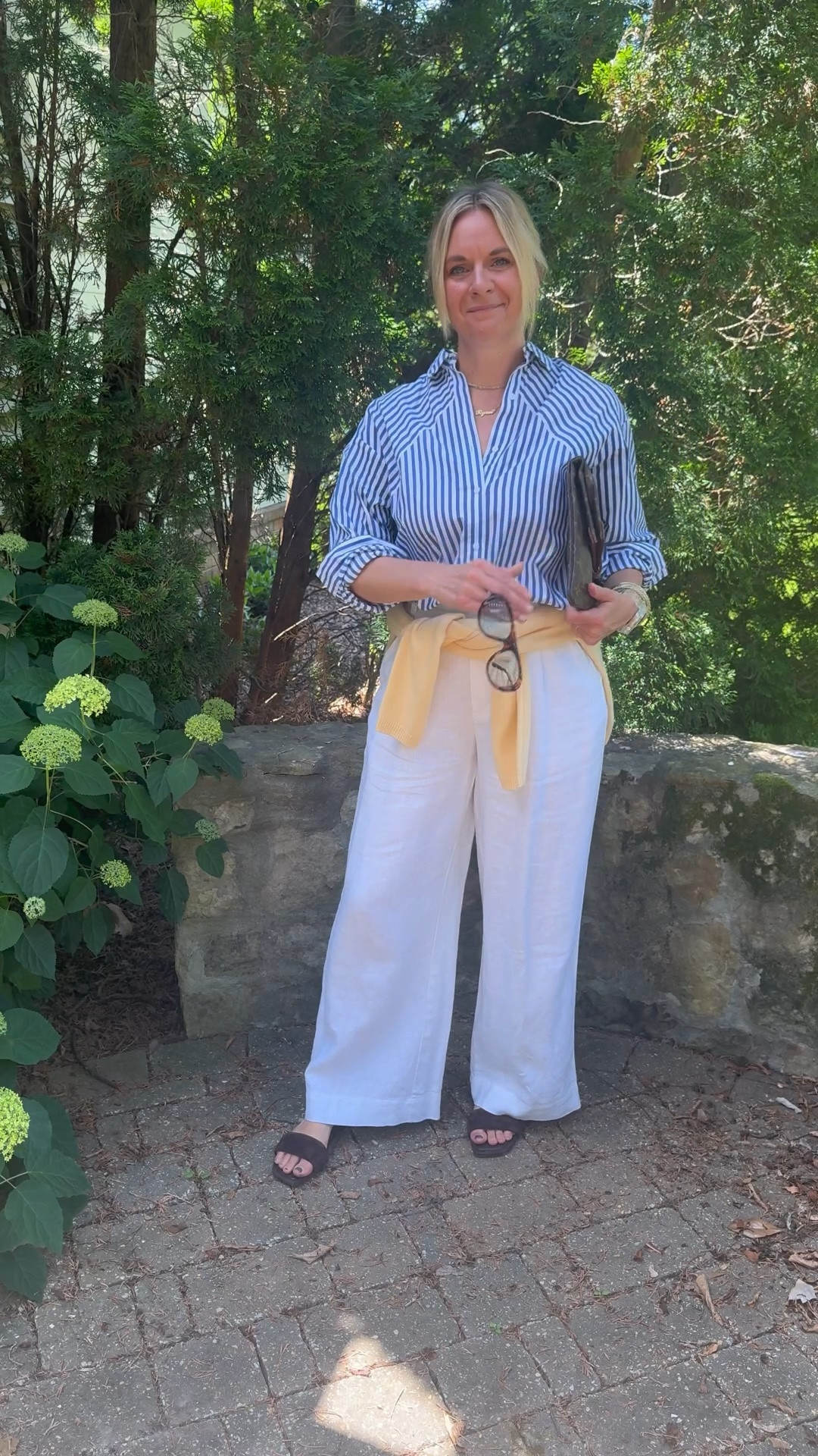 OOTD before heading out for a client personal shopping appointment ✨ Blue and white striped shirt + white wide leg linen pants + yellow cardigan tied at the waist + brown suede slide sandals + layered necklaces + blue lens sunglasses. All from my own closet — linked the closest versions I could find. Everything shoppable below! 👇

#LTKootd #LTKdayinmylife #LTKOver40