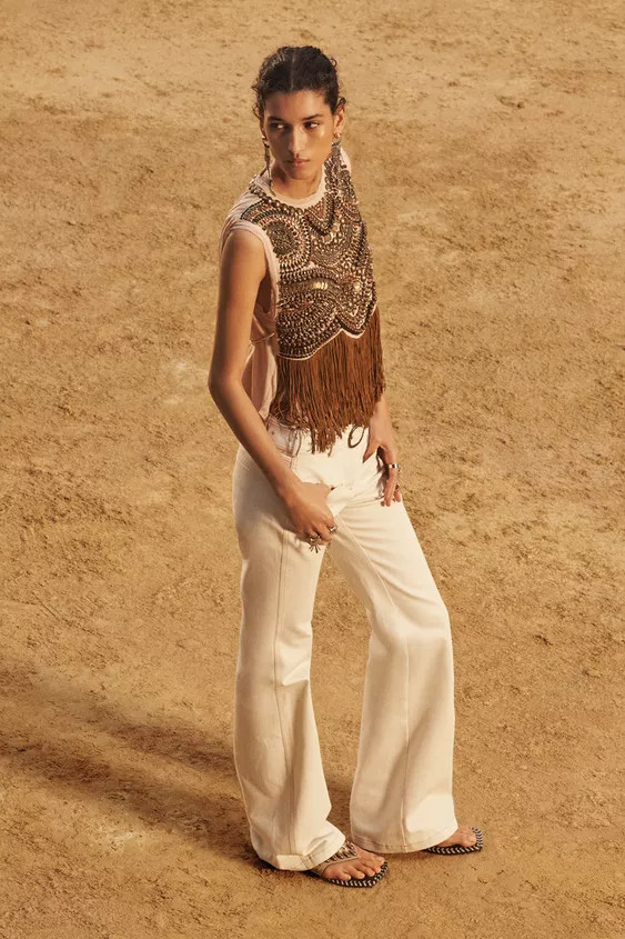 Sleeveless round neck top. Embroidered detail with beading and fringe. Adjustable drawstring wais... | Zara US