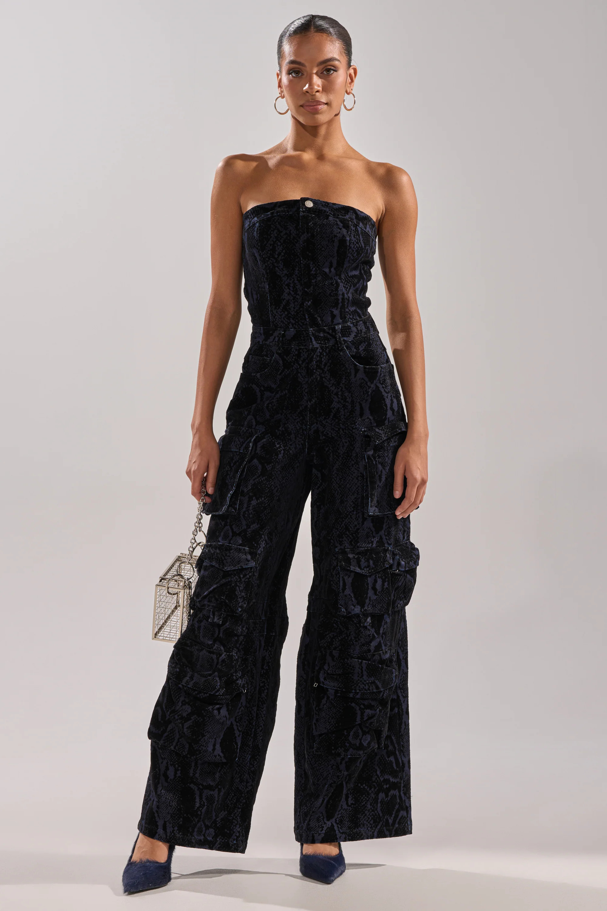 CAUGHT YOUR EYE VELVET DENIM JUMPSUIT IN SNAKEPRINT | AKIRA