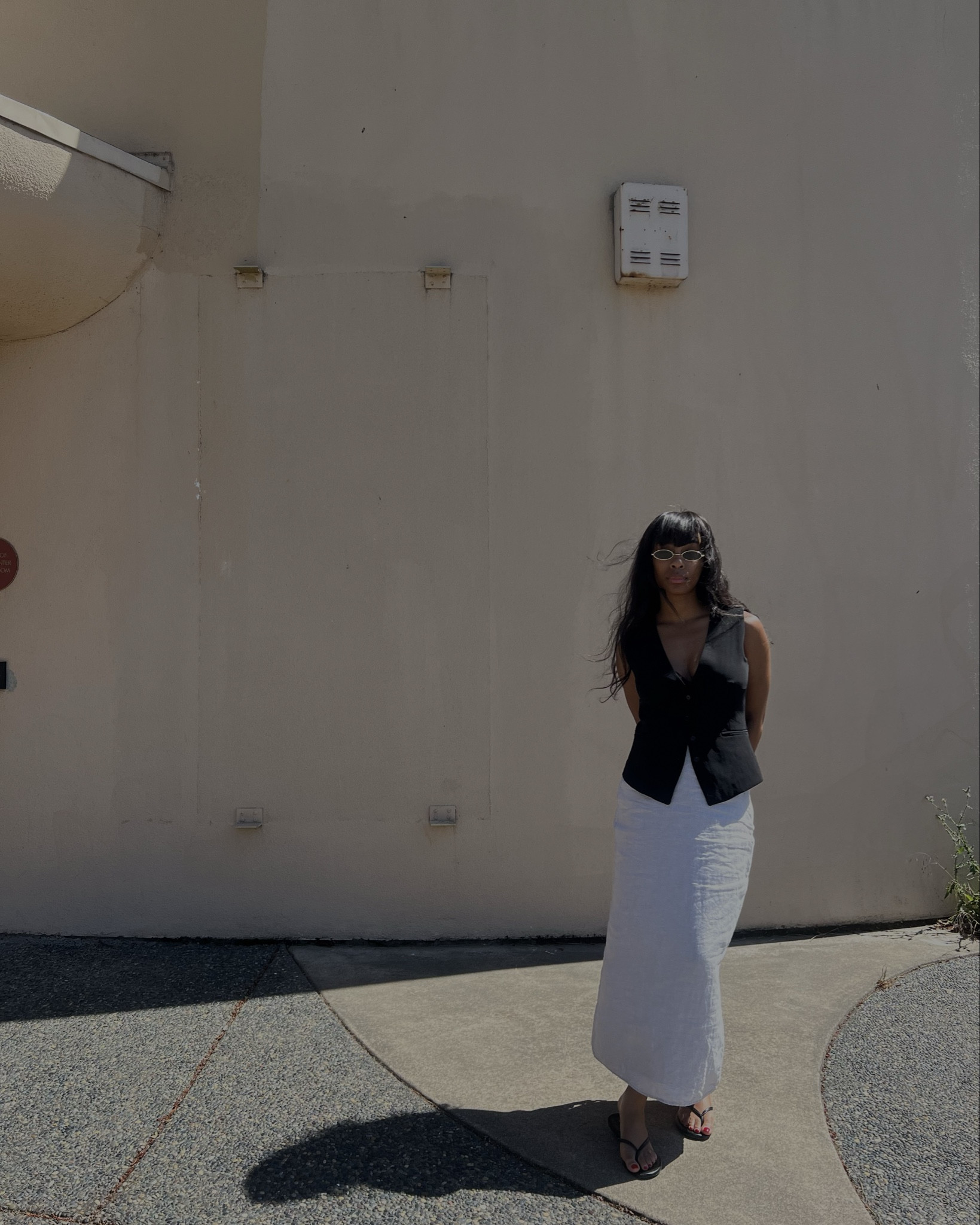 black vest, tan skirt, black sandals.

#LTKShoeCrush #LTKStyleTip