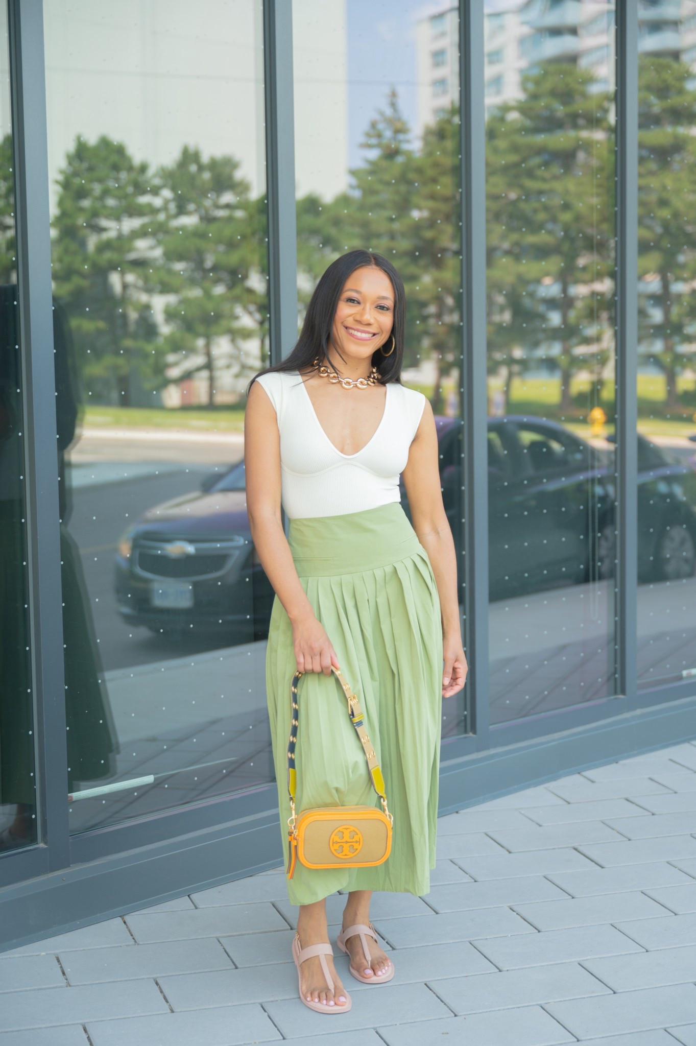 Spring outfit inspiration. I absolutely love a flowy full midi skirt. I paired it with a bodysuit and the Tory Burch mini miller crossbody one of favourites!

Spring outfit 2026, resort wear, vacation outfit, date night outfit, summer outfit, summer concert outfit, how to style, midi skirt, concert bag, mini bag 

#LTKTravel #LTKootd #LTKFestival