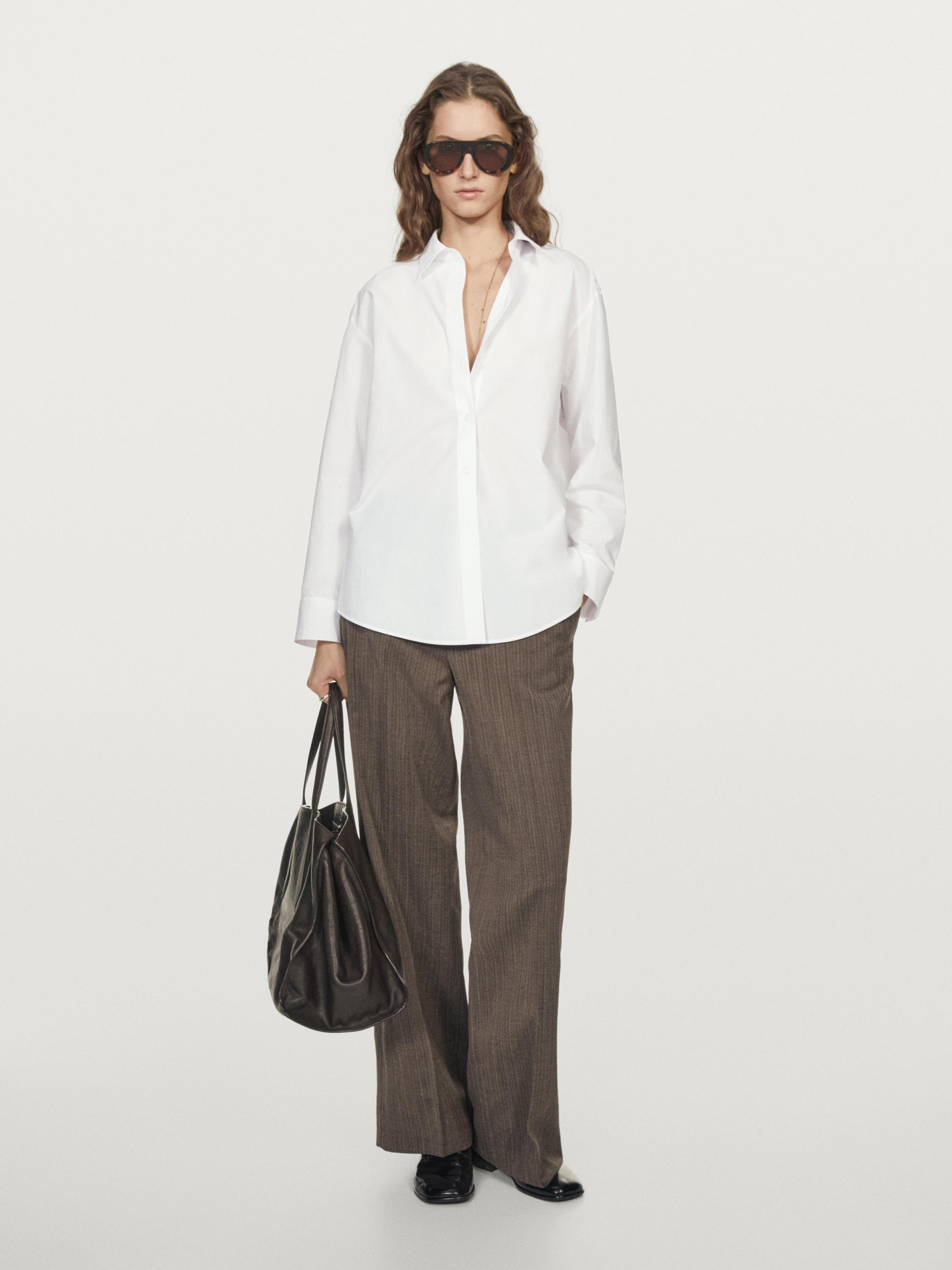 Shirt made of 100% cotton fabric. Long sleeves with buttoned cuffs. Shirt collar. Button-up front... | Massimo Dutti UK