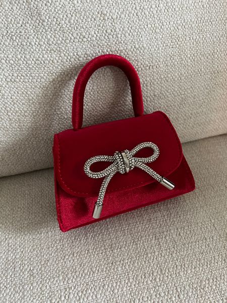Think Valentine’s Day with this darling little red velvet mini bag with crystal bow! It is the perfect pop of red for a date night! Comes in Lots of colors! 

#LTKGiftGuide #LTKMostLoved #LTKitbag