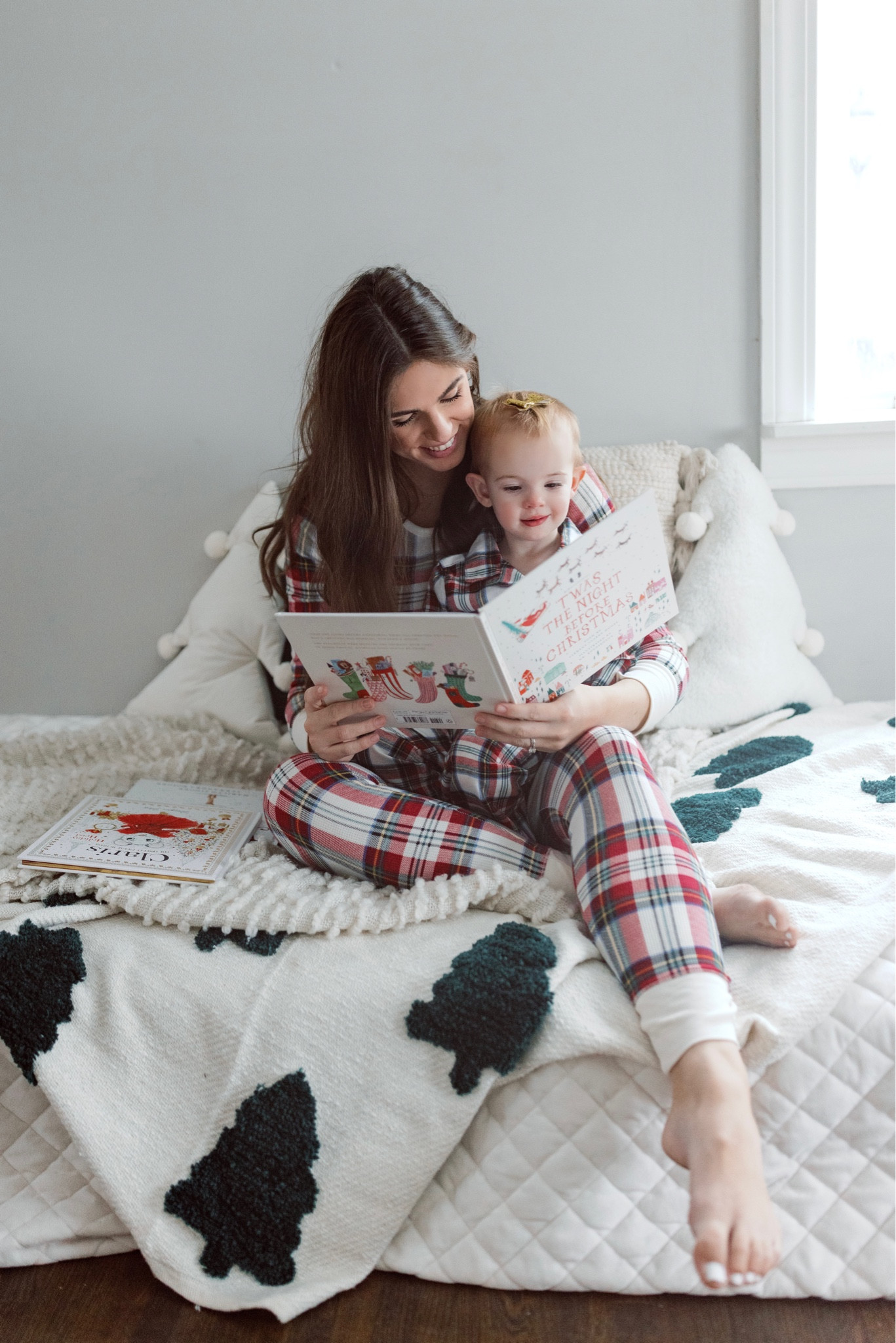 Family pajama and Christmas photo inspiration. Mommy and me + maternity - reading Christmas books 

#LTKkids #LTKHoliday #LTKbump
