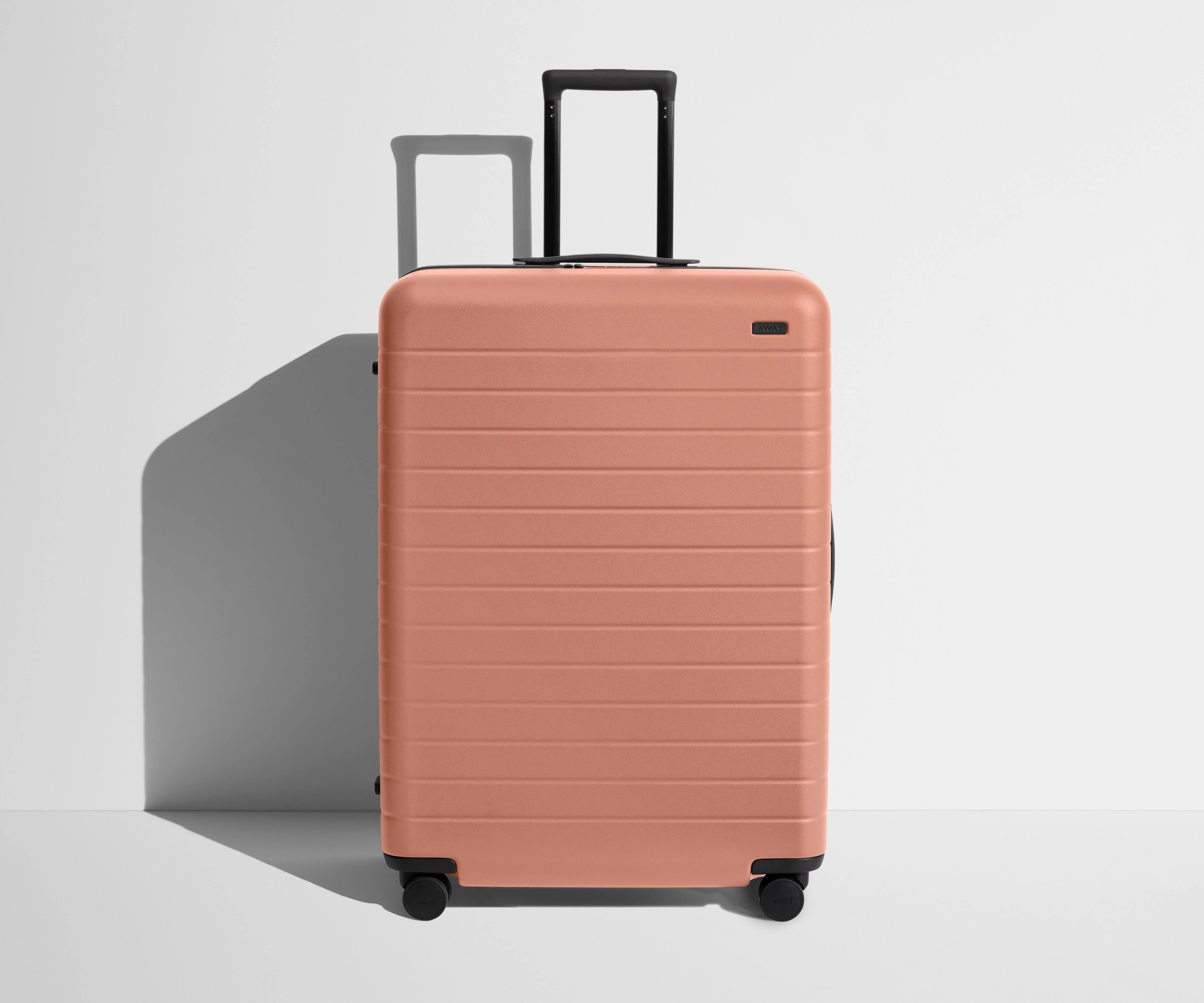 Shop Large & Checked Suitcases in Clay Pink | Away | Away