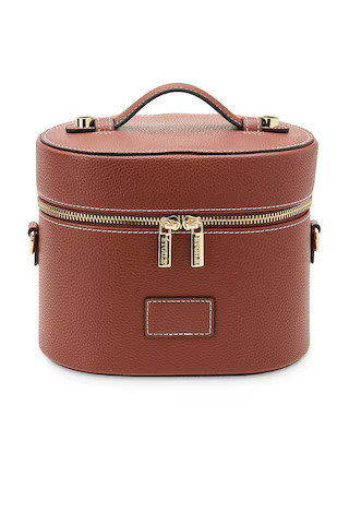 Oval Toiletry Case in Ginger Brown | Revolve Clothing (Global)