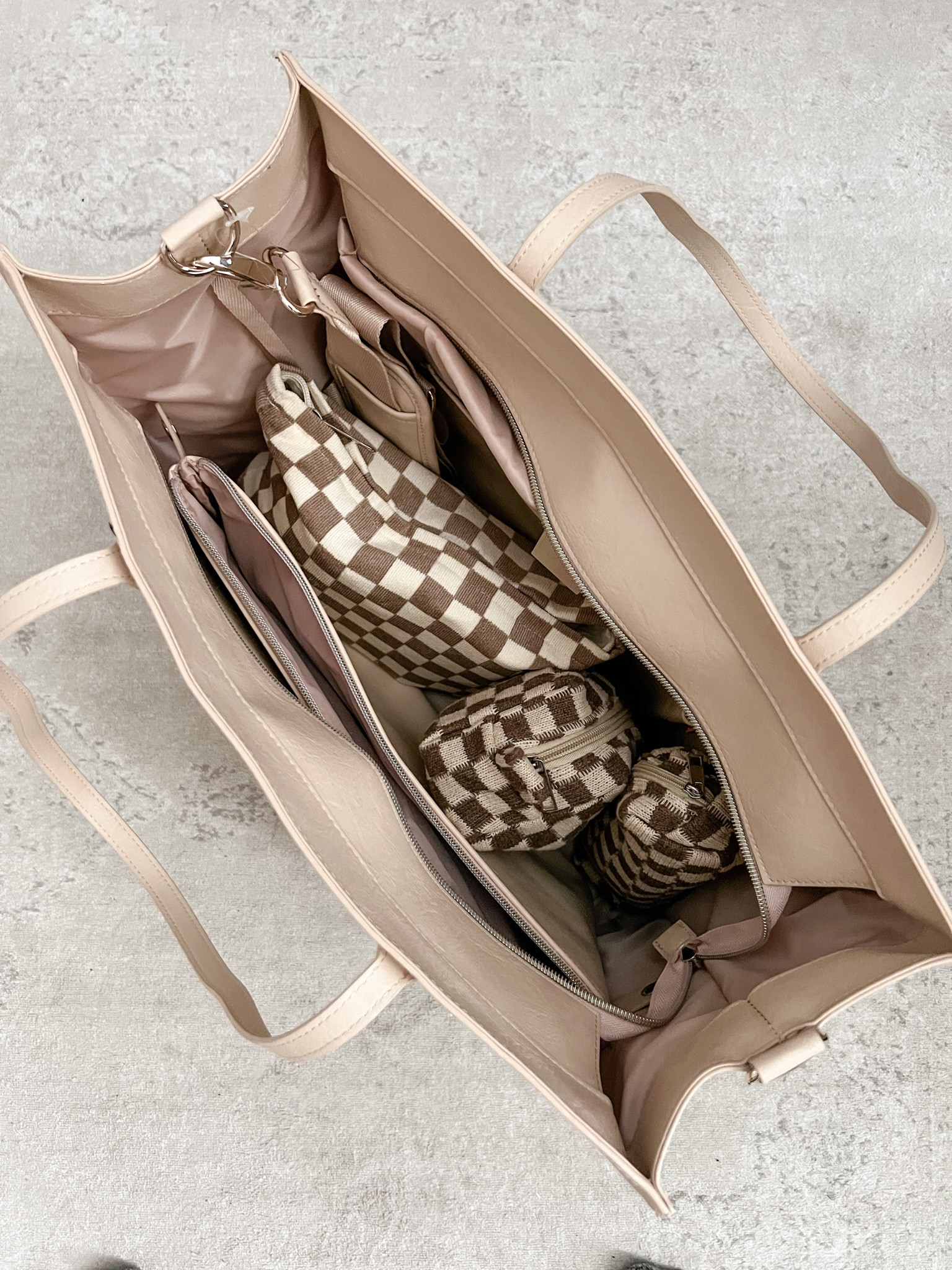 I traveled this weekend and loved using my beis work tote to carry my toiletries, makeup, and haircare! Amazon finds, work tote, work bag, beis luggage, checkered makeup bag 

#LTKitbag #LTKtravel #LTKFind