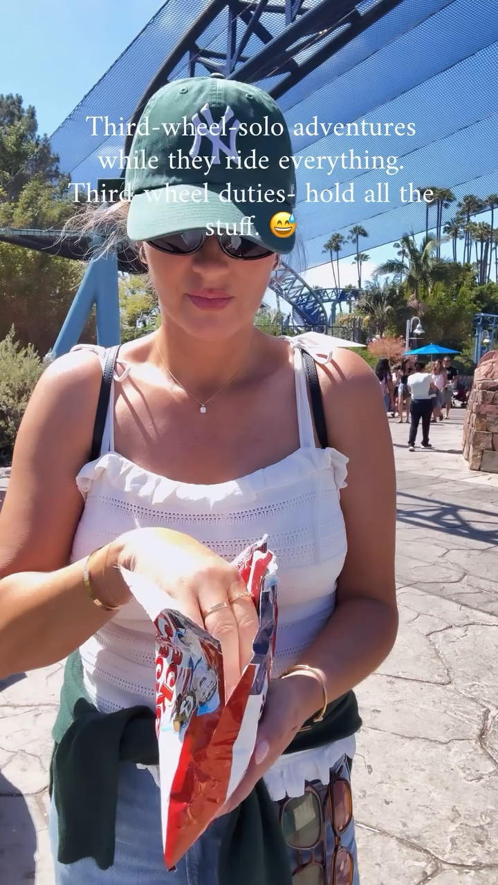 Who needs every ride when you can people-watch, snack, and hold everyone’s things? 😅

#thirdwheel #summer #relatable #explore #momlife