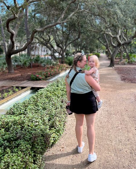 living our 30a dreams in water color in this beautiful part of town. my black tennis dress was perfect for this hot day with a button down tank over it tied in a knot. perfect for keeping cool, cute, preppy and still being perfectly comfortable with the family. white sneakers are my go-to, wearing true to size as my normal running shoes. this whole outfit is a timeless vacation outfit classic. you’ll find yourself wearing it both everyday and on the road for a cute travel look  

toddler tie sleeve romper and bow also tagged. was a great warm weather vacation outfit. the long linen pants m the baby romper kept the sun at bay! 

#LTKtravel #LTKxPrime #LTKmidsize