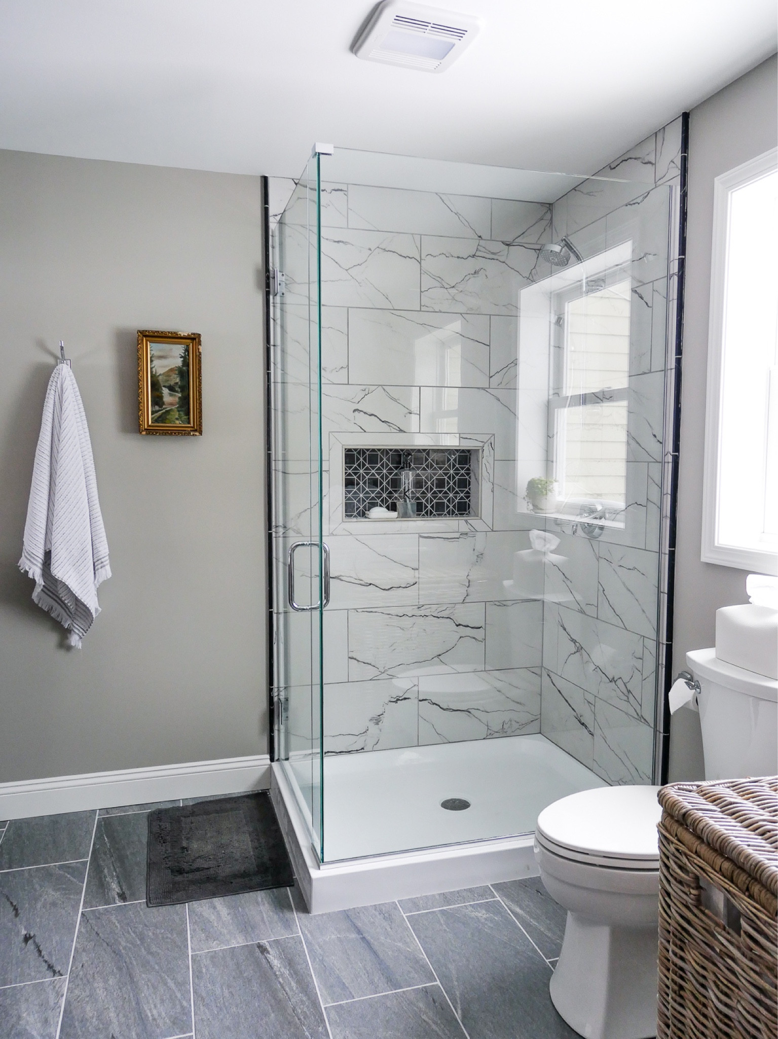 Our tile shower turned out incredible with a marble look a like porcelain tile and honed marble niche mosaic. The floor is porcelain tile as well  

#LTKMostLoved #LTKhome