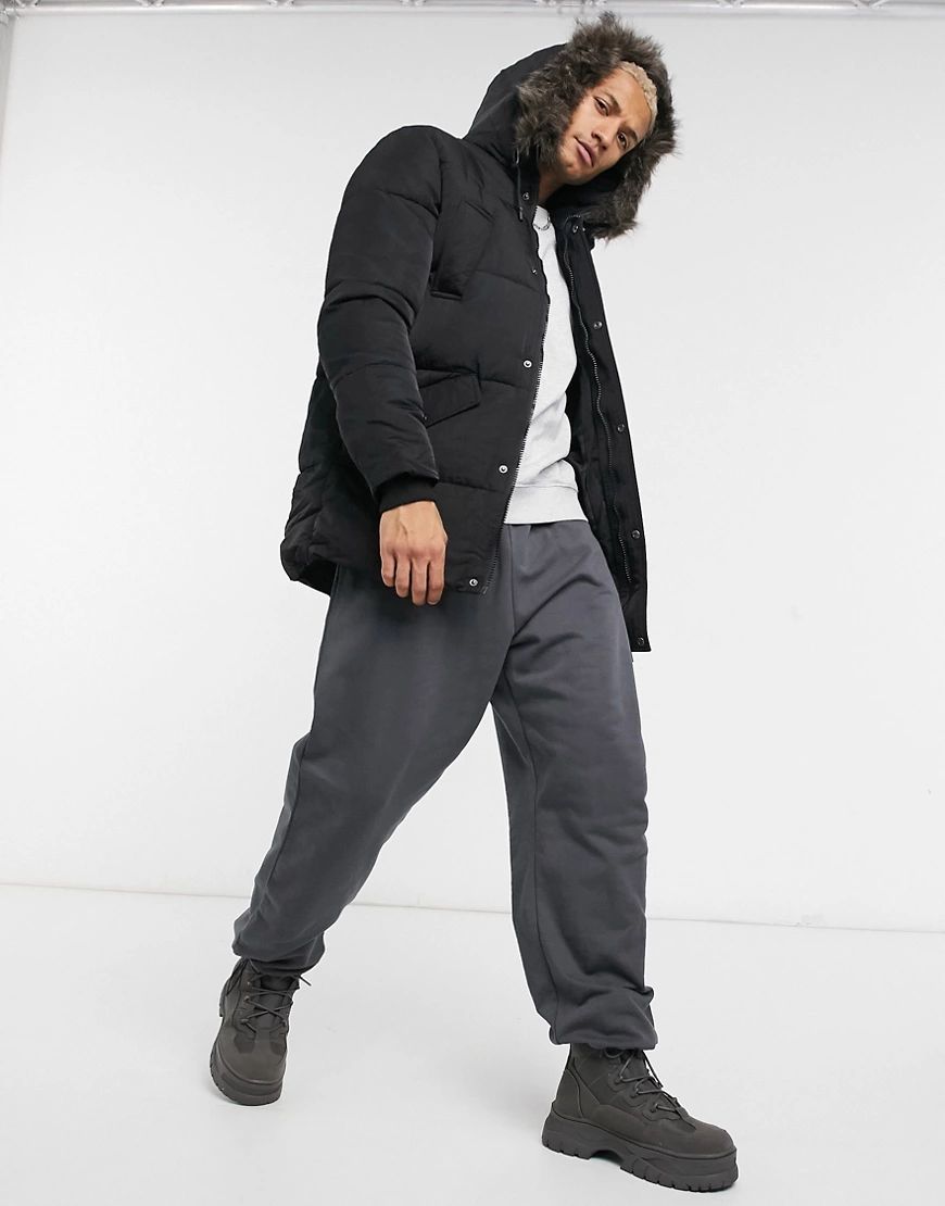 ASOS DESIGN puffer jacket with faux fur hood in black | ASOS (Global)