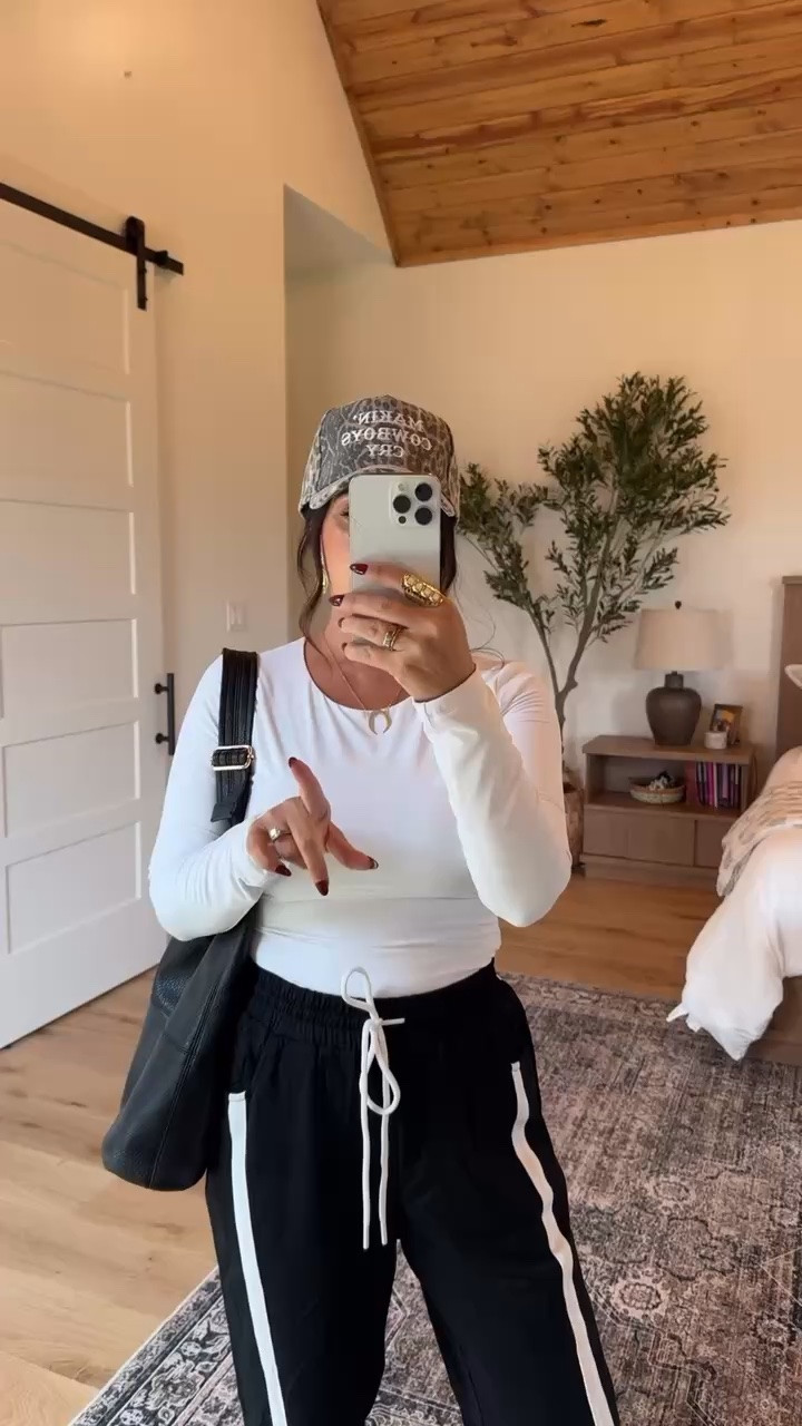 Sporty, comfortable, and so easy to wear! These striped track pants paired with a fitted white top, chunky sneakers, and camo hat make the perfect everyday athleisure outfit.
#AthleisureOutfit #TrackPants #SportyChic #CasualStyle #EverydayOutfit #LTKStyleTip #LTKFinds