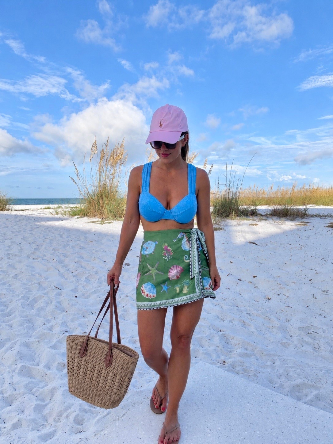 Beach vacation outfit perfection 🌴 This bright blue bikini paired with the printed wrap sarong is such an easy, colorful look for walking the beach, grabbing lunch or heading from the pool to the resort. Add a baseball cap + woven tote and you’re set!

beach vacation outfit, tropical vacation style, resort wear, bikini outfit, beach cover up, sarong wrap skirt, vacation swimwear, beach outfit ideas, girls trip outfit, resort vacation outfit, summer beach style, colorful swimwear, woven beach bag

#LTKTravel #LTKSeasonal #LTKdayinmylife