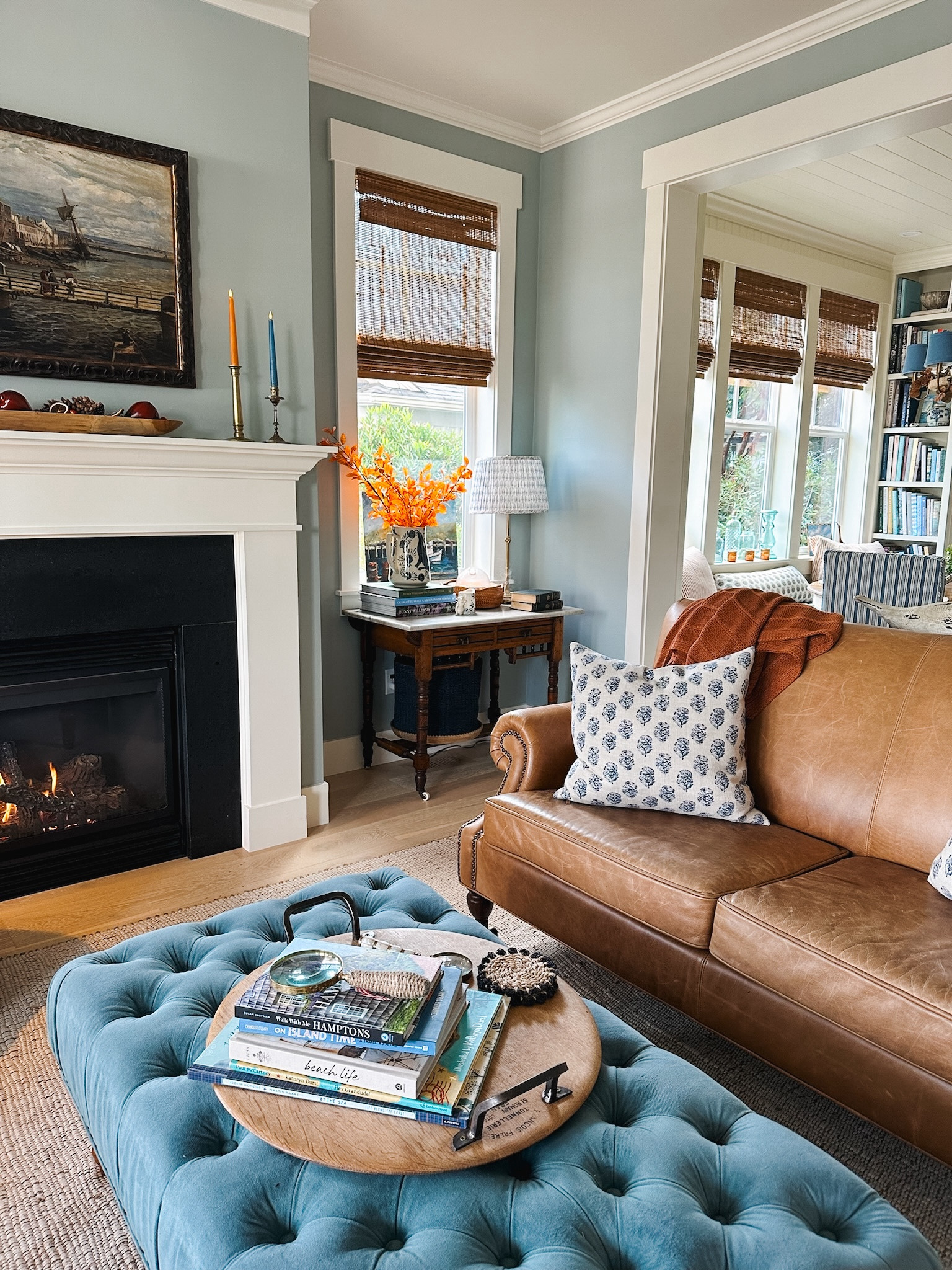Living room sources - pleated lampshade leather couch block print pillow bamboo shades fall stems / branches wood bowl on mantel burnt orange throw blanket dining chandelier bunny pitcher 

#LTKHome #LTKSeasonal #LTKSaleAlert