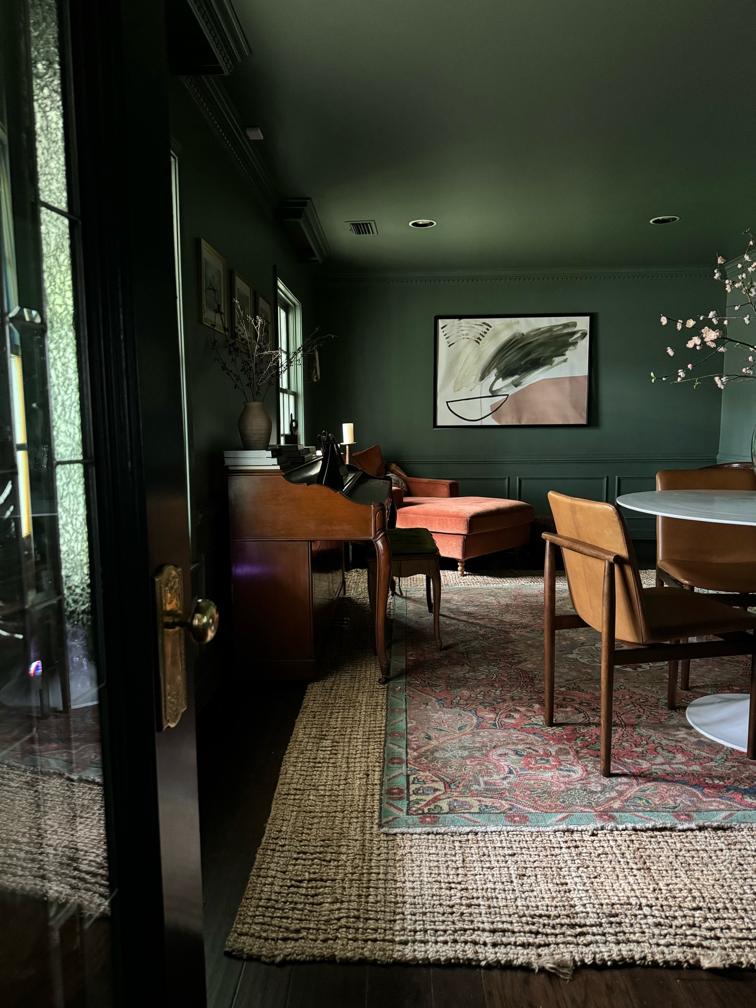 Our moody study, with area rug, desk or dining table, velvet chaise, floor lamps, and wall art. 

#LTKhome