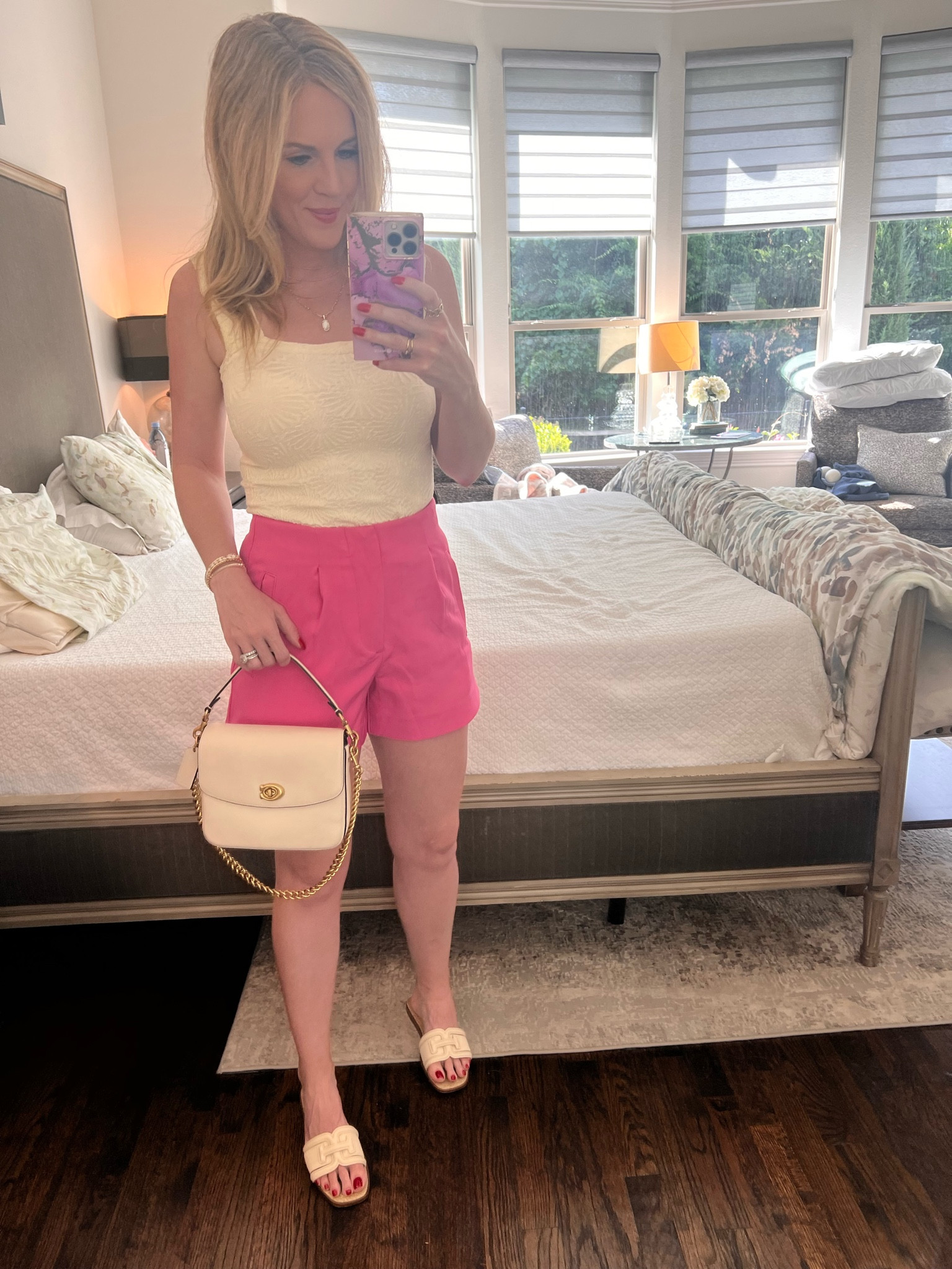 Casual summer outfit 
Pink shorts / target shorts / high waisted shorts / dolce vita shoes / white slip on / white slide / white sandals / cream sandals / coach bag / mini tote / mini bag / free people / free people tank 

#LTKunder50 #LTKSeasonal #LTKshoecrush
