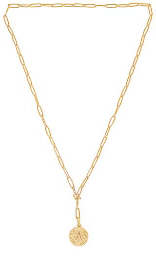 BRACHA Initial Medallion Lariat Necklace in Metallic Gold. - size B (also in A, C, D, E, G, H, K, M, | Revolve Clothing (Global)