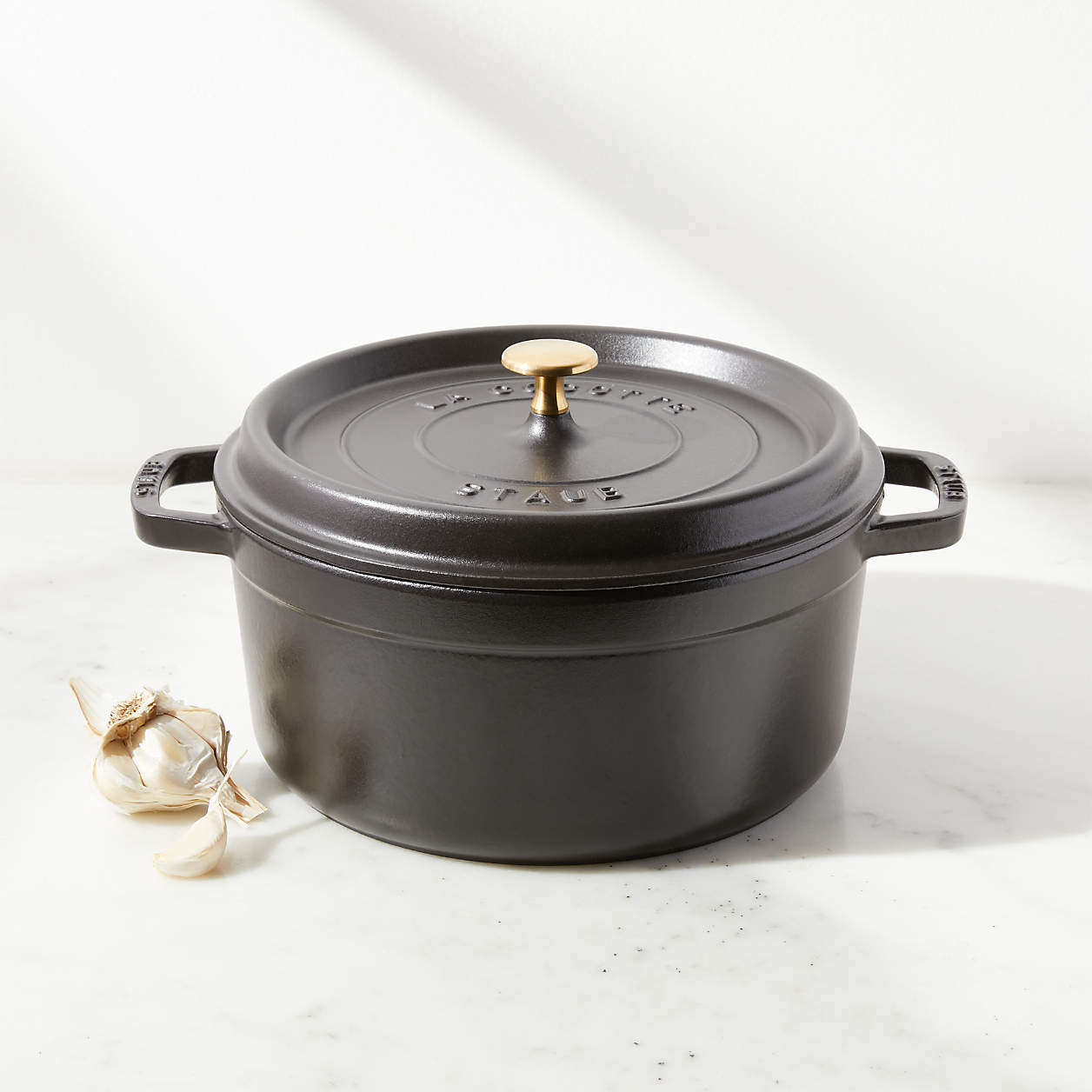 Staub 5.5-Qt Round Grenadine Red Cocotte + Reviews | Crate and Barrel | Crate & Barrel