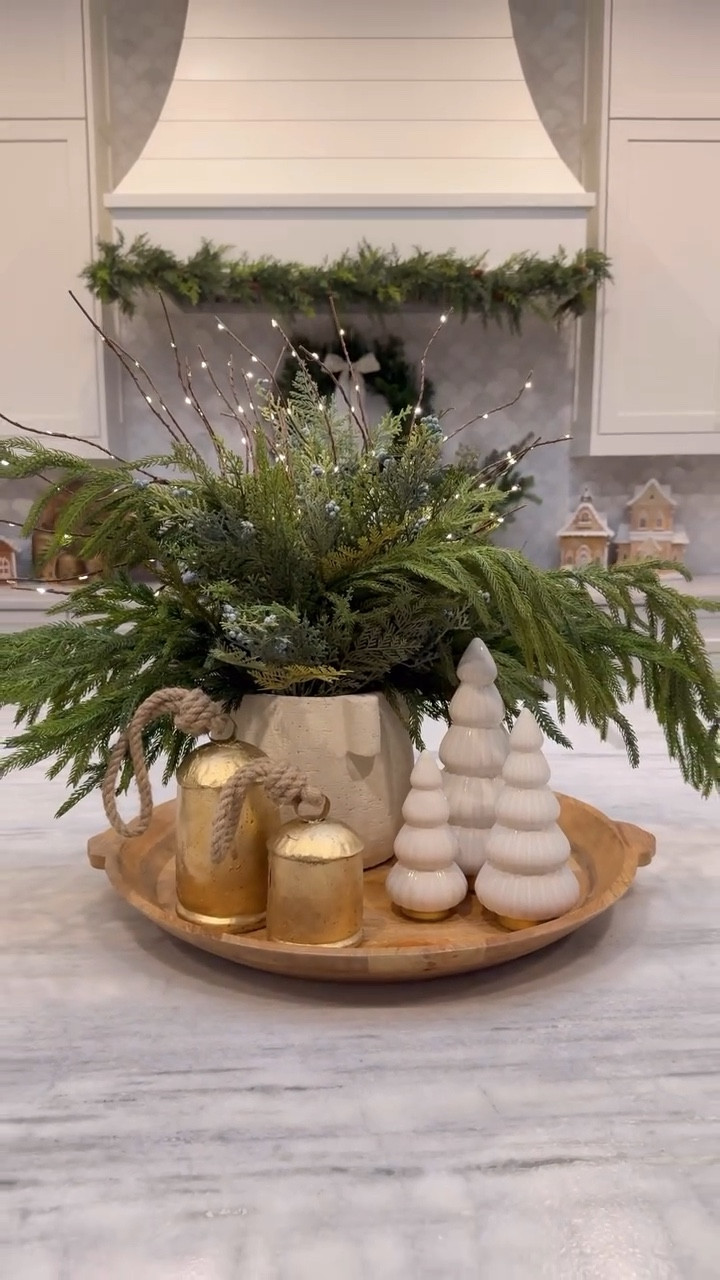 🎄Christmas Kitchen Centerpiece🎄
Here is a Christmas centerpiece idea that would be so cute on your kitchen island for the holiday season! I have been using these greenery stems for a couple years now and they are still my favorite! The light up branches are a fun touch and look beautiful at night..you can set them on a timer so they will turn on in the evening! 

#LTKVideo #LTKSeasonal #LTKHome