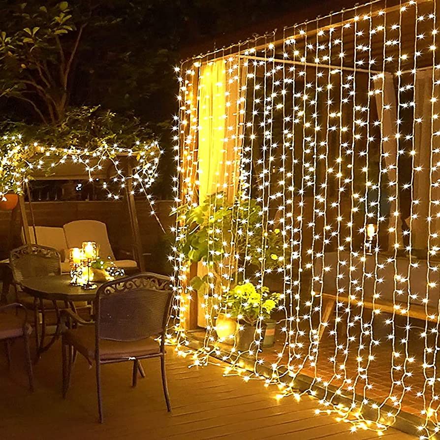 JMEXSUSS 300 LED Remote Control Christmas Curtain Lights, Plug in Fairy Curtain Lights Outdoor, W... | Amazon (US)