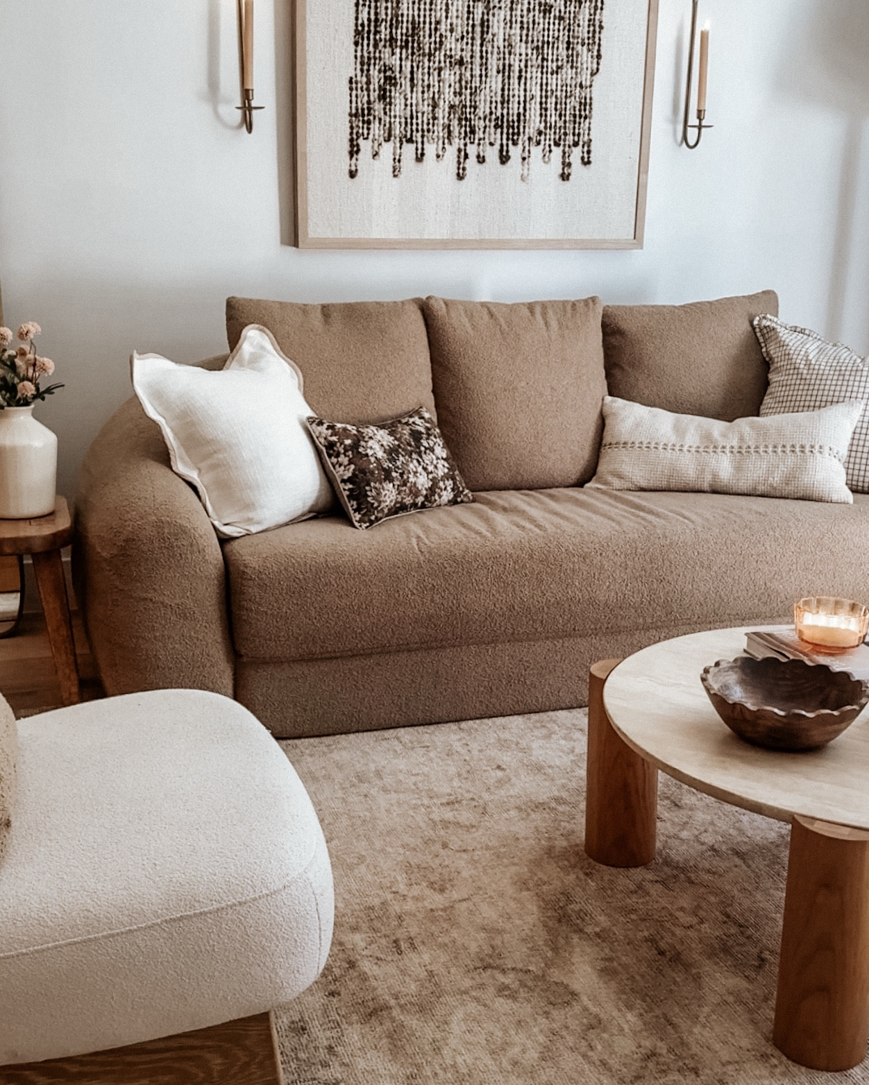 Soft florals, earthy tones, and a little extra texture – just enough to freshen the space without losing that calm, neutral feel. Swapped the throw pillows, added new faux stems, and updated the art… and suddenly the whole room feels lighter but still cozy.

#LTKSeasonal #LTKHome
