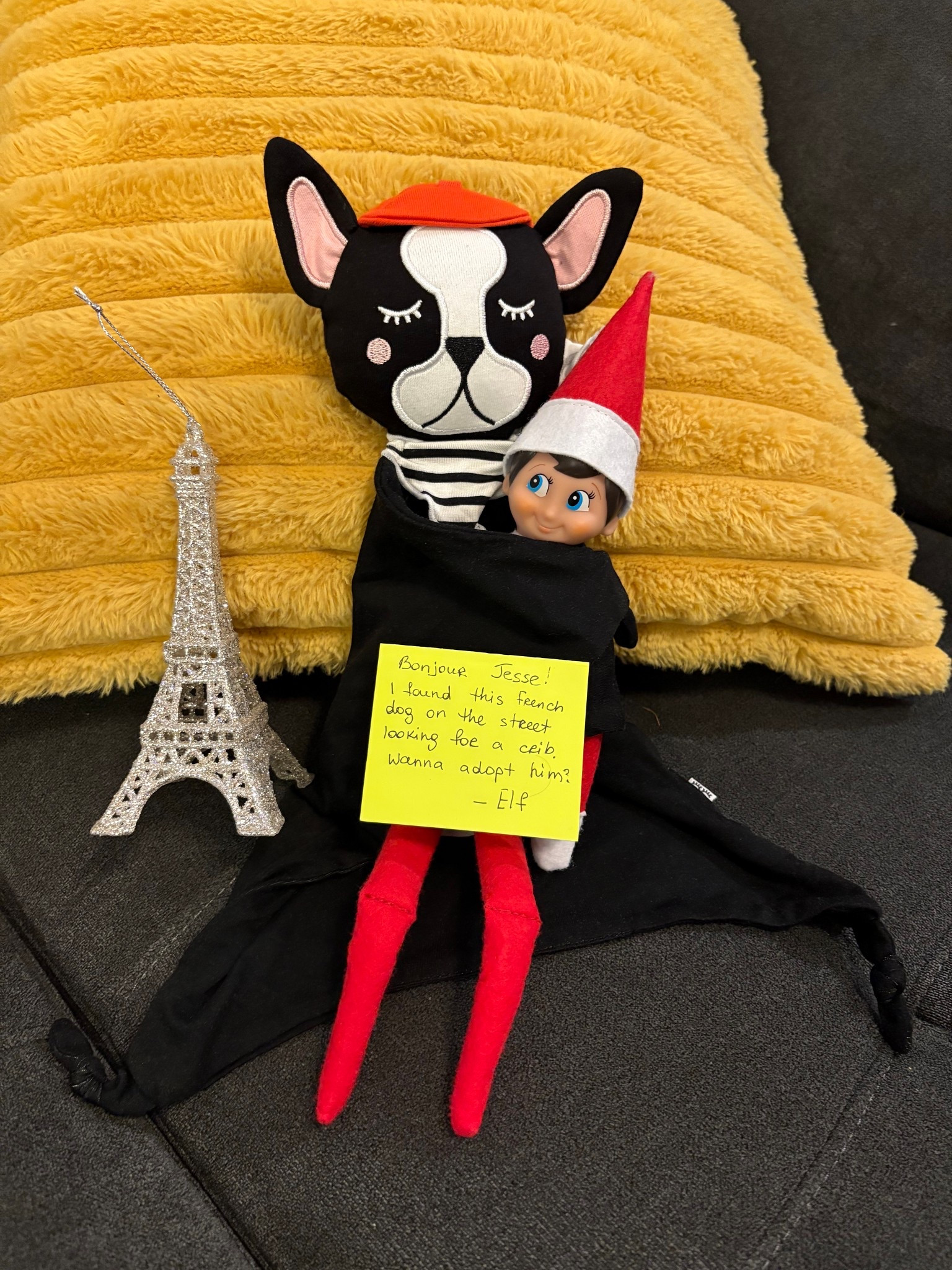 Elf on the shelf is introducing a French bulldog lovie to a kid.  

#LTKGiftGuide #LTKHoliday #LTKBaby