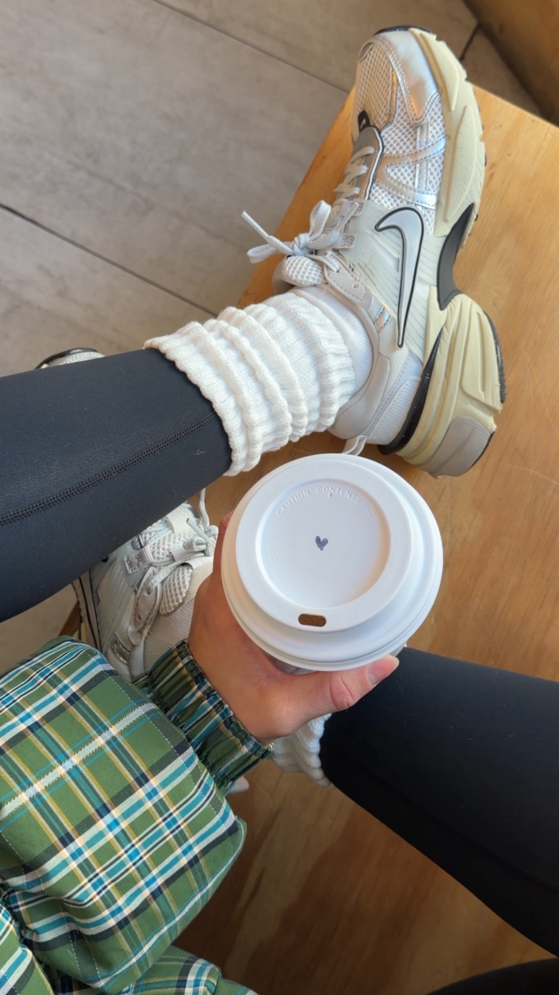 11/30/25 Sharing my cozy coffee shop outfit today and linking all the details. Wearing my Abercrombie knit beanie hat, my favorite Free People plaid green puffer jacket (wearing an XS — it runs pretty oversized), my Set Active black leggings (XS), my Aritzia slouchy socks, and my Nike sneakers that are truly my most comfortable pair. Cozy, warm, and perfect for a slow morning at the coffee shop.



#LTKGiftGuide #LTKootd #LTKCyberWeek