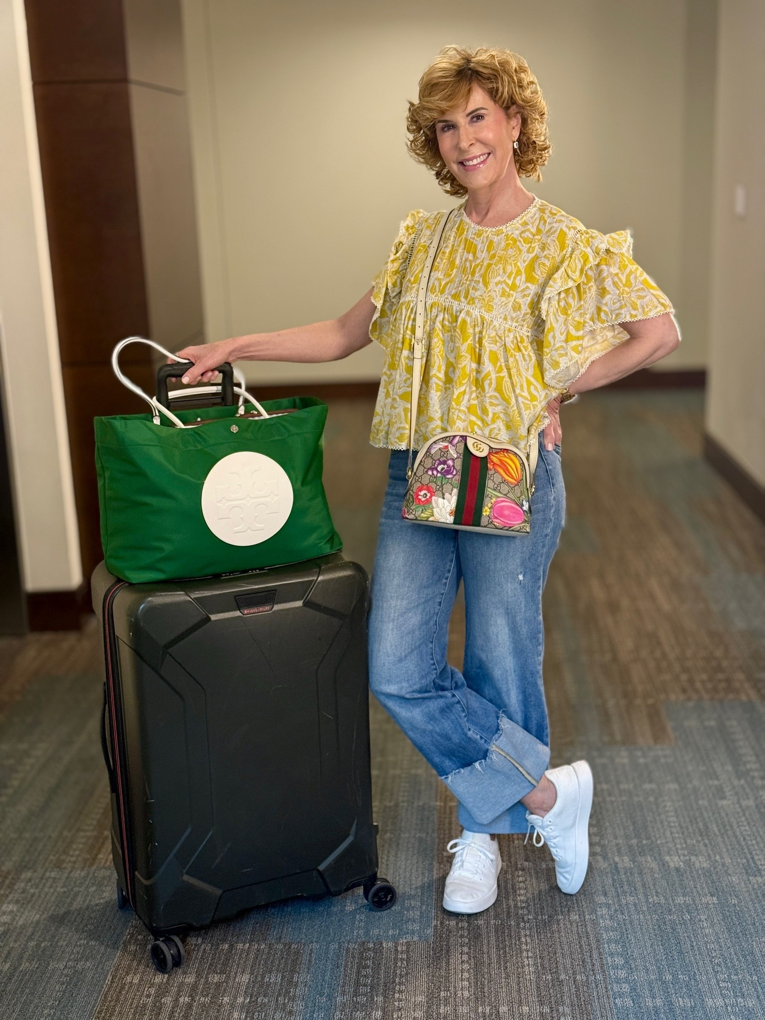 Heading to Atlanta for the first BHeading to Atlanta for the first Baylor game of the season! 💚💛 For travel days, I want to be comfortable, but I still want my outfit to feel cute! I paired this fun yellow flutter-sleeve top with relaxed cuffed jeans and my favorite white sneakers for an easy, comfy airport look. Add a colorful crossbody and my carry-on, and I’m ready to go. Sic ’Em, Bears! 🐻✈️

#LTKootd #LTKOver40 #LTKTravel